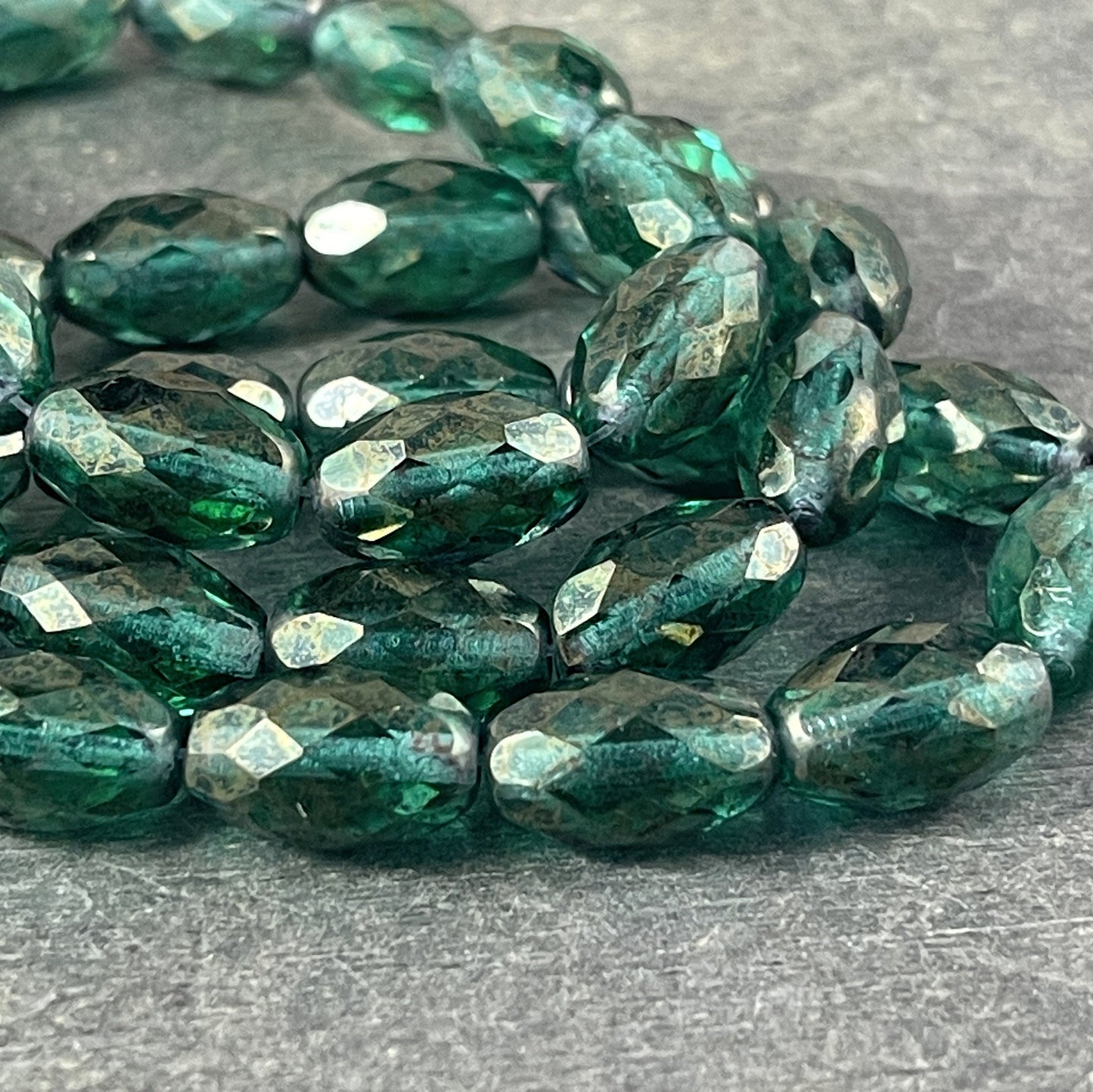 Emerald Green Faceted Oval Beads, 12mm Transparent Green with Golden Luster (FOV/N-1222) * Qty. 12