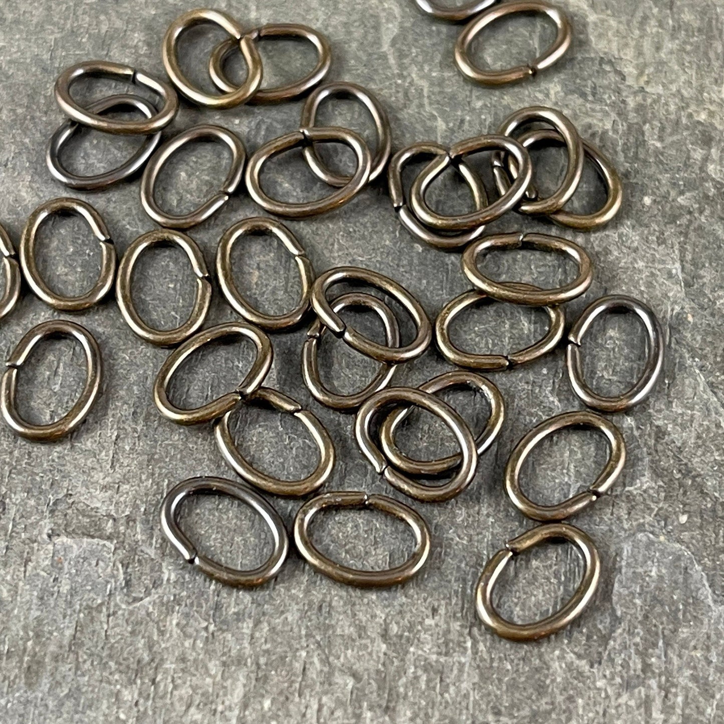 8x6mm Oval Jump Rings, 18g Open, Antiqued Brass Plated (FMG/5063) * Qty. 100