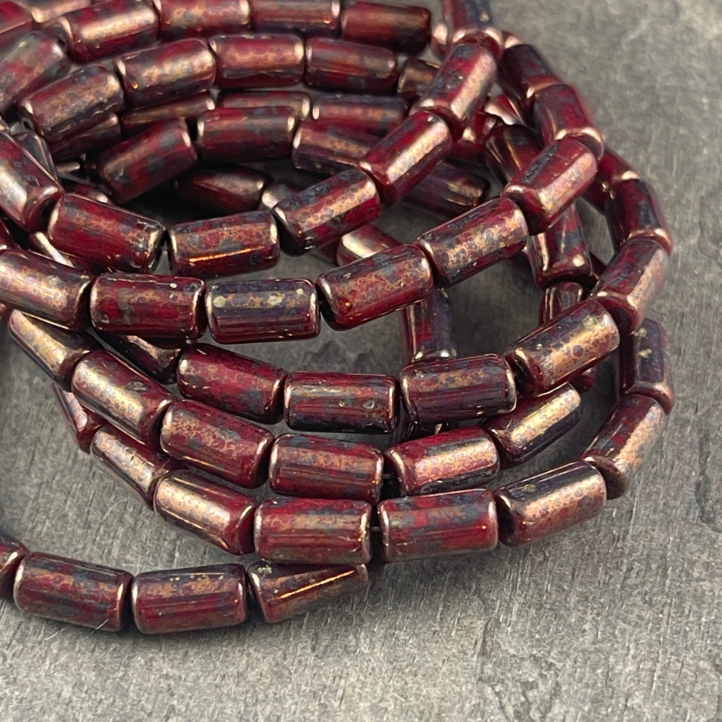 Czech Glass Beads - 9x5mm Tube Bead, Opaque Maroon with Bronze Picasso (TBE/N-0671) * Qty. 16