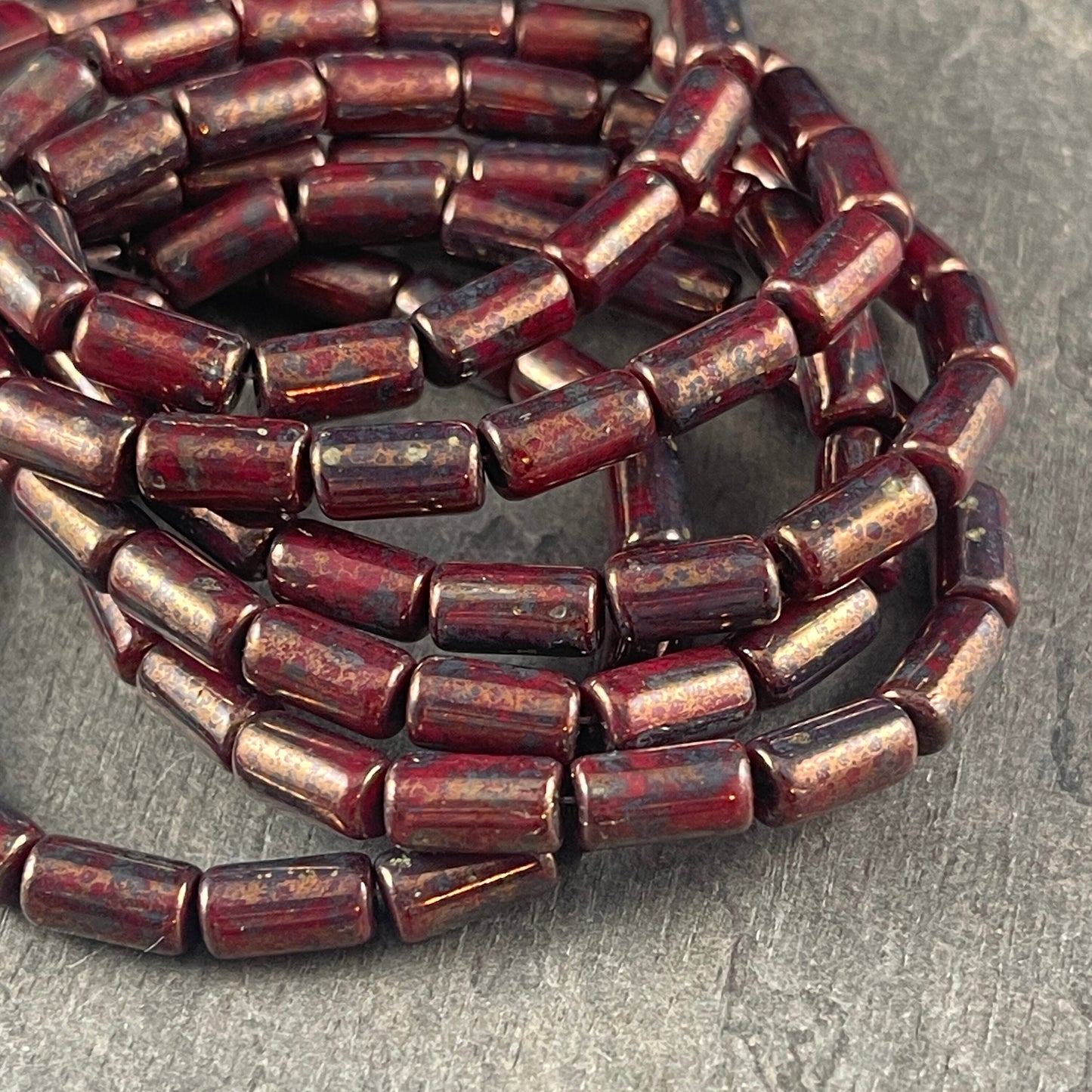 Czech Glass Beads - 9x5mm Tube Bead, Opaque Maroon with Bronze Picasso (TBE/N-0671) * Qty. 16