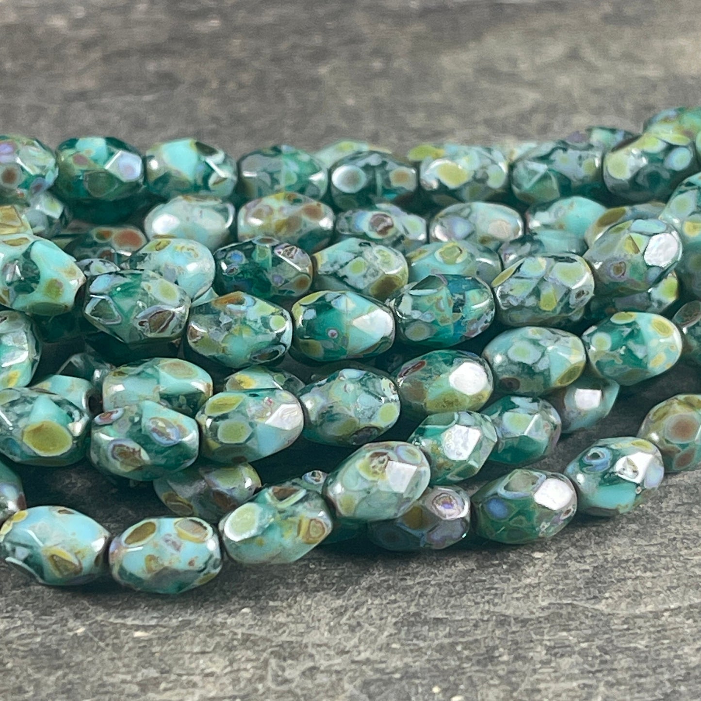 Czech Glass - 7x5mm Faceted Oval, Turquoise, Capri Blue and Emerald Green with Picasso Finish (FOV/N-0601) * Qty. 20
