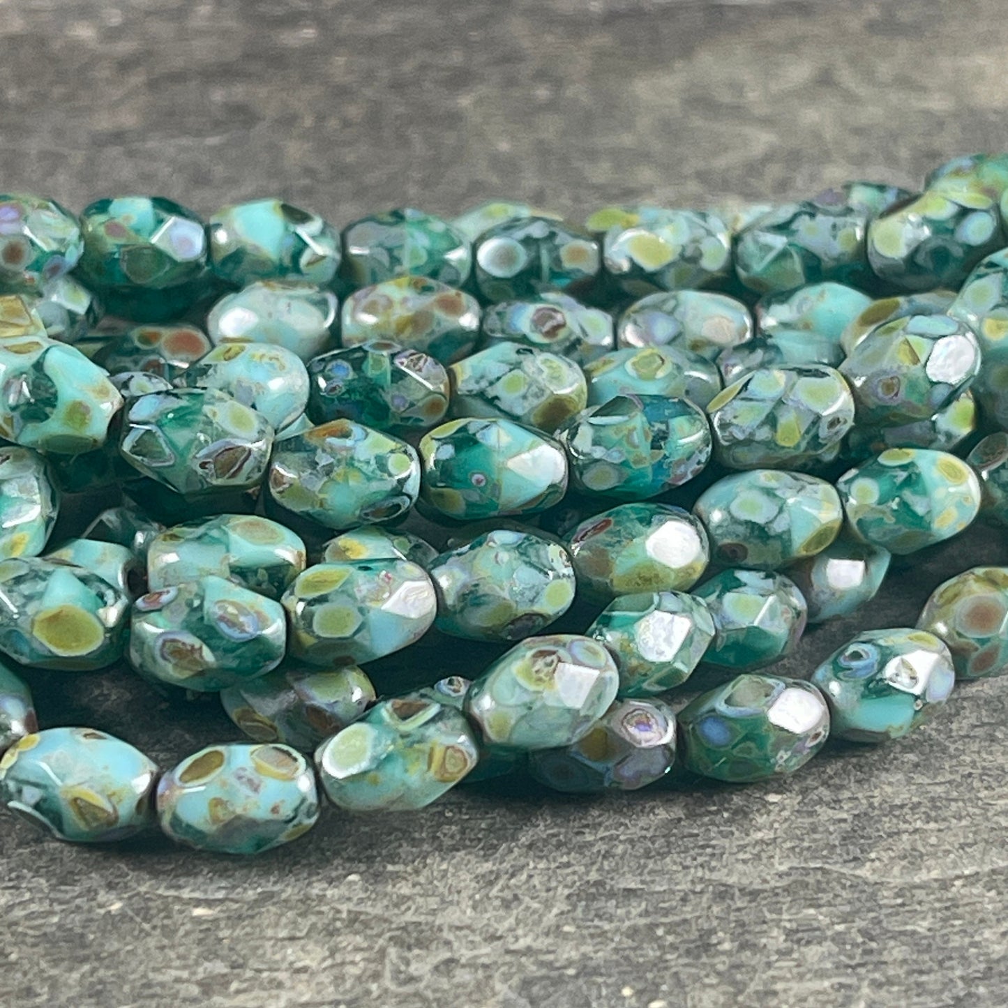 Czech Glass - 7x5mm Faceted Oval, Turquoise, Capri Blue and Emerald Green with Picasso Finish (FOV/N-0601) * Qty. 20