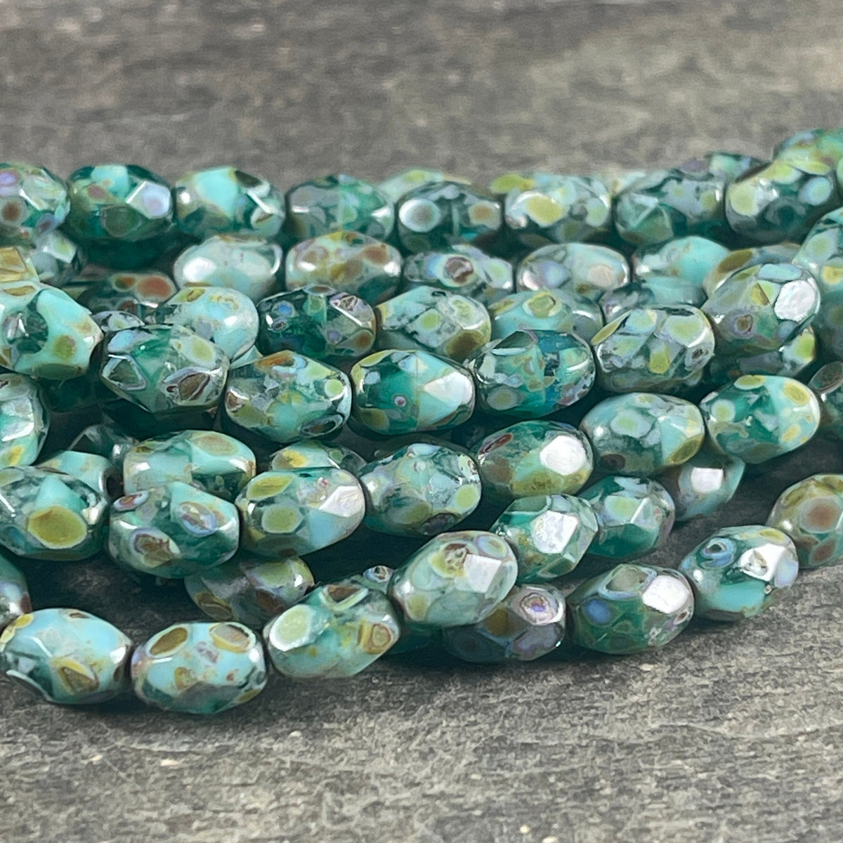 Czech Glass - 7x5mm Faceted Oval, Turquoise, Capri Blue and Emerald Green with Picasso Finish (FOV/N-0601) * Qty. 20