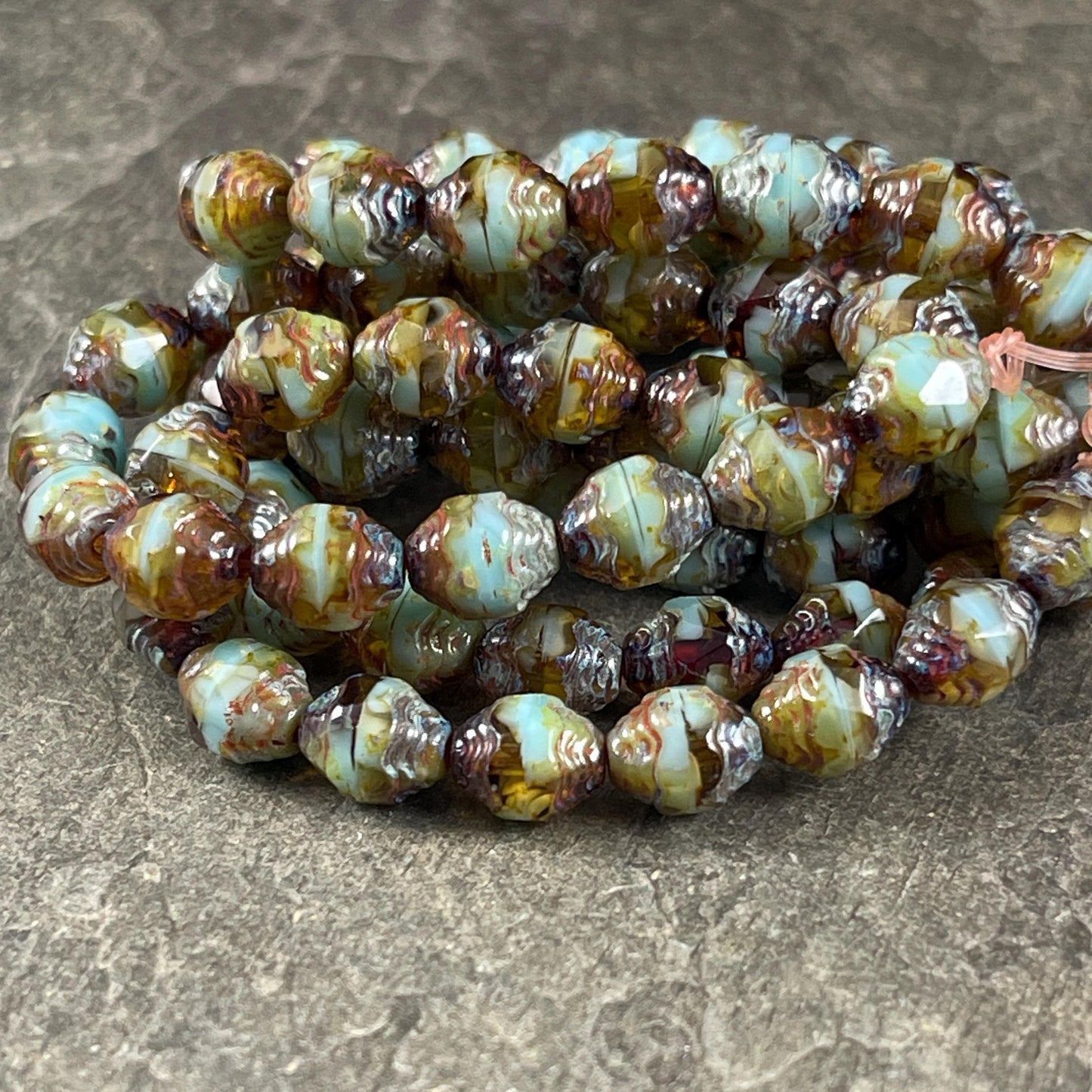 Czech Glass Beads - Sky Blue and Brown Picasso Cathedral 8x6mm Carved Oval Bicone (CTD/N-048) * Qty. 15