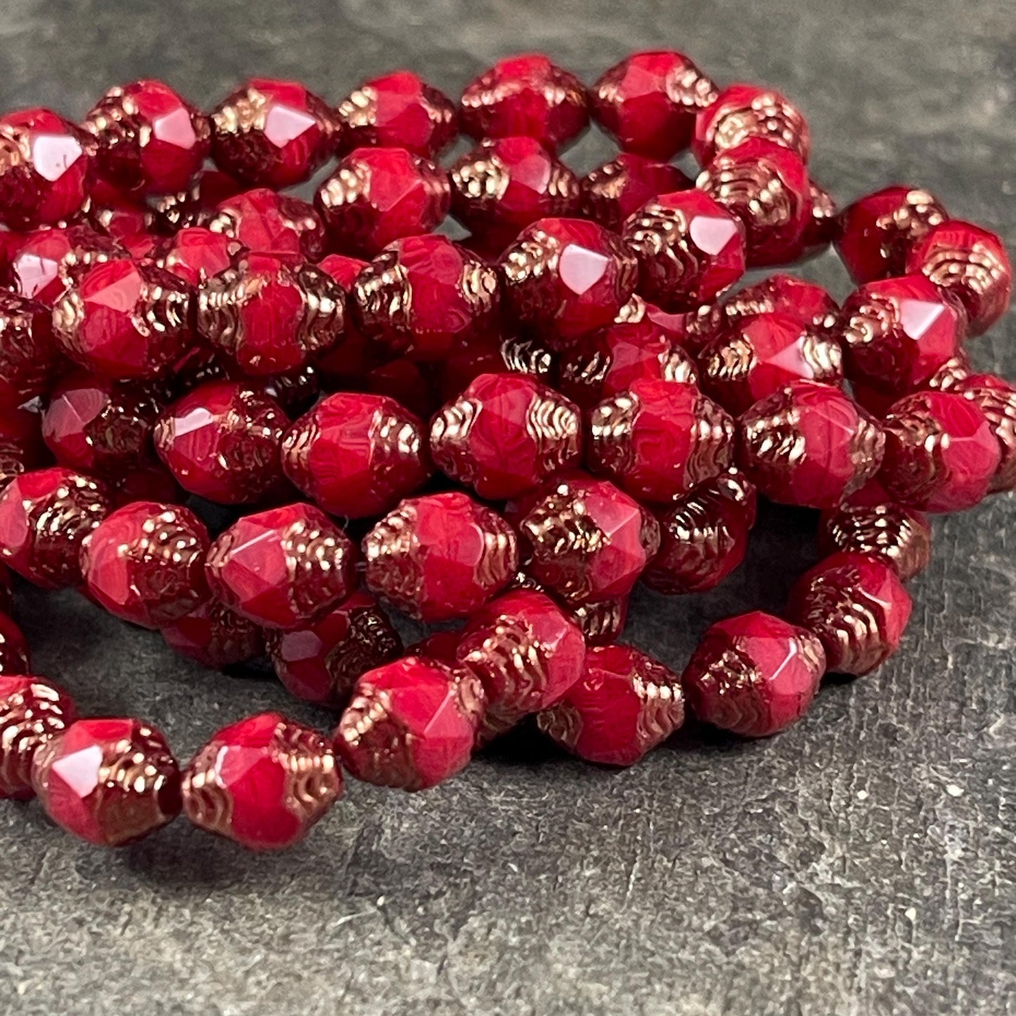 Czech Glass Beads, Red Cathedral 8x6mm Carved Oval Bicone (CTD/N-007) * Qty. 15