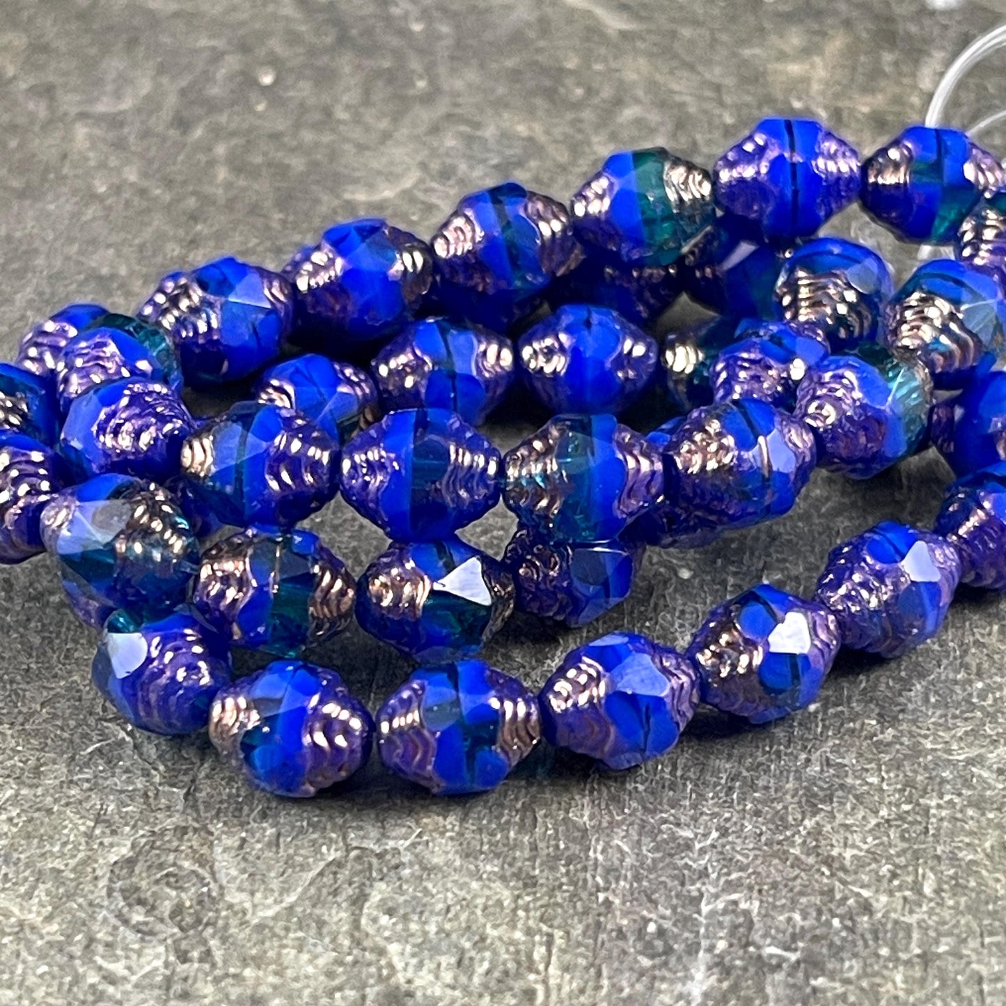 Czech Glass Beads - Royal Blue Cathedral 8x6mm Carved Oval Bicone (CTD/N-051) * Qty. 15