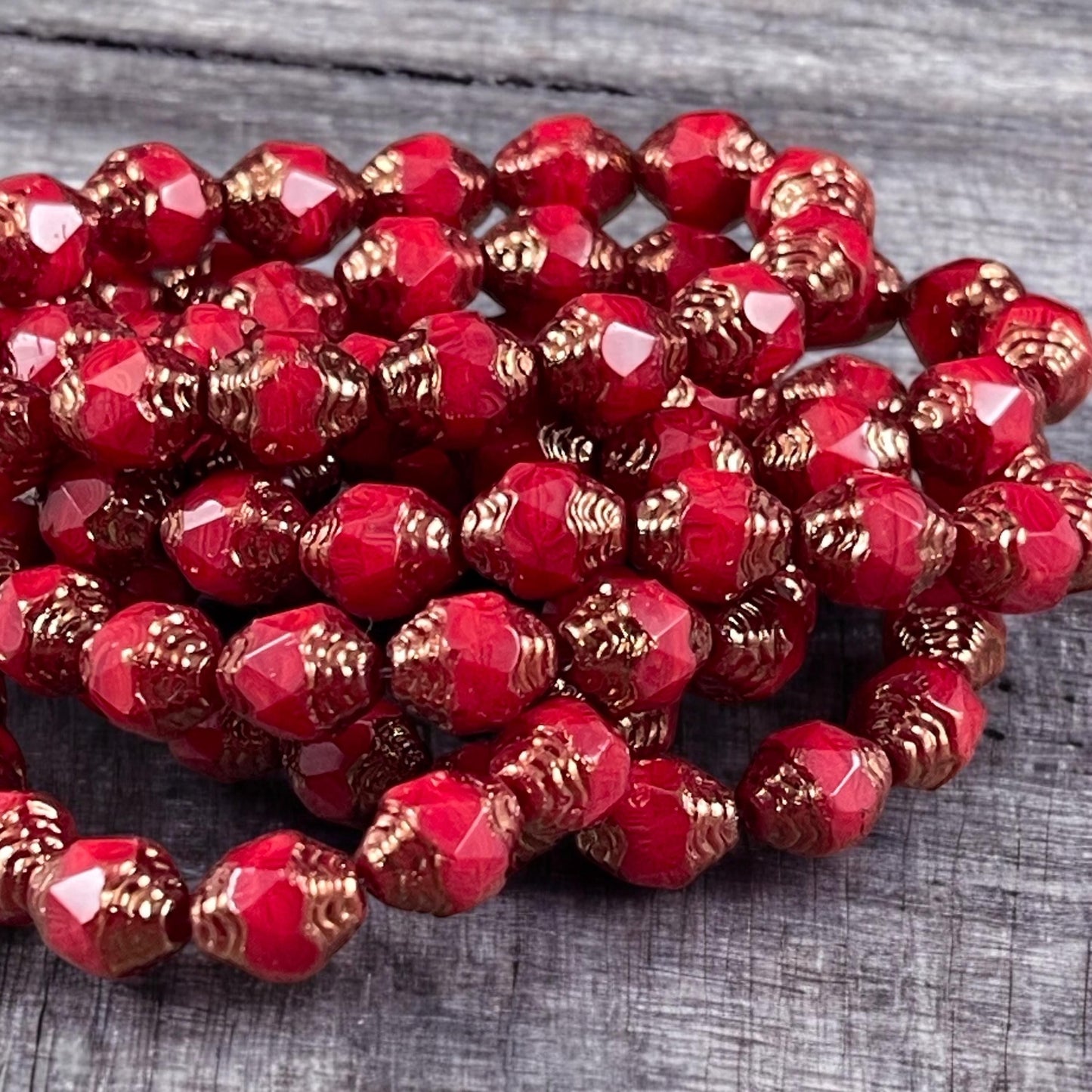 Czech Glass Beads, Red Cathedral 8x6mm Carved Oval Bicone (CTD/N-007) * Qty. 15