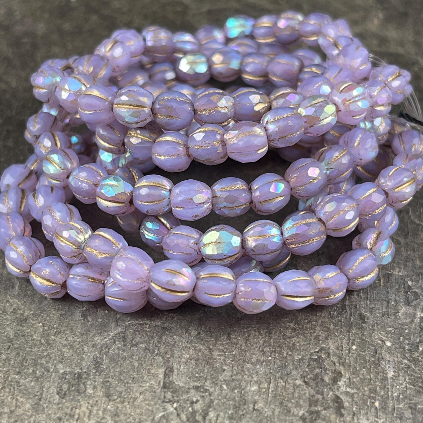 Czech Beads - 5.5mm Faceted Melon, Thistle with AB and Gold Wash (FM6/N-0247) * 25 beads