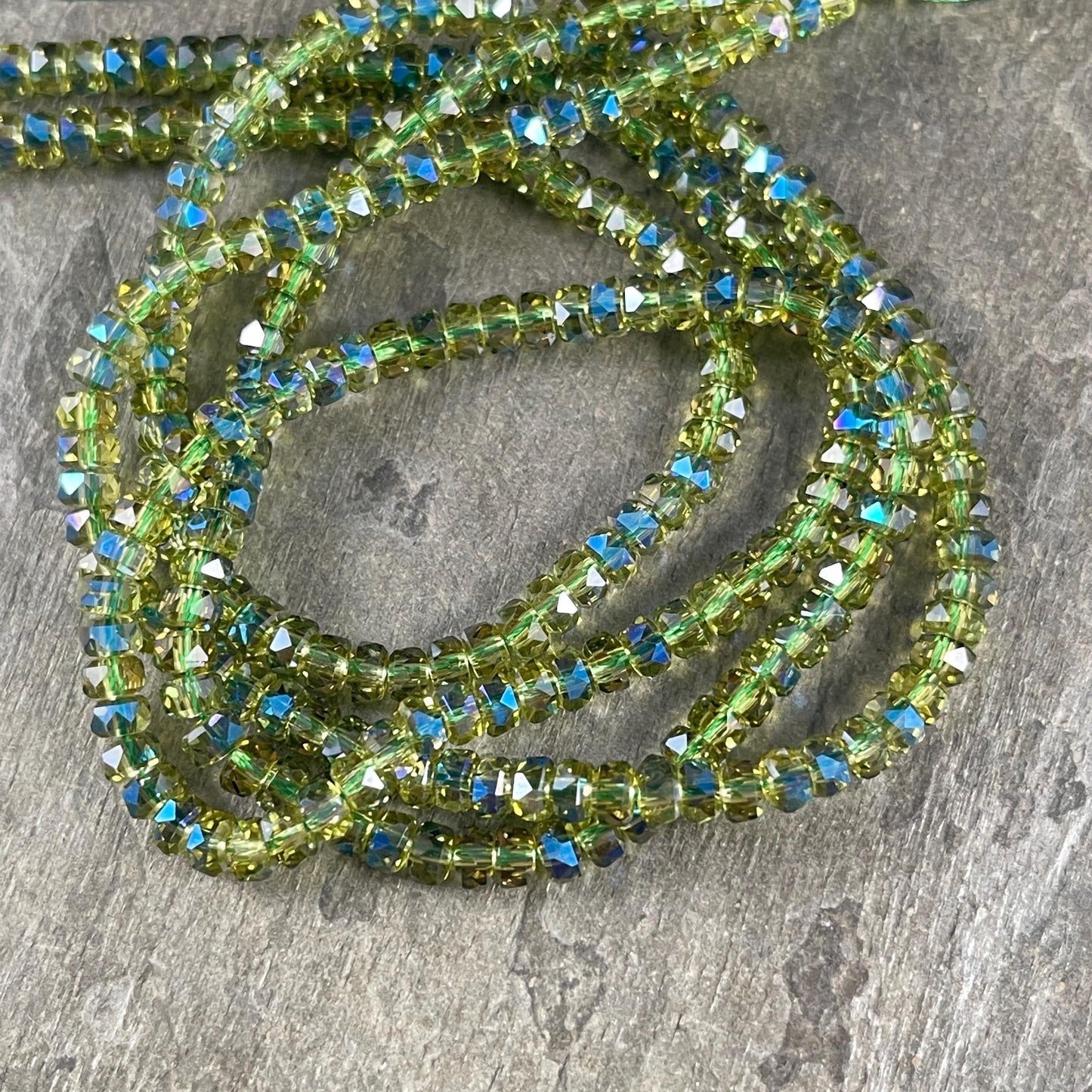 Faceted Glass Beads - 4x2.5mm Heishi Rondelles, Transparent Olive Green with Rainbow AB Finish (Peridot-AB) * 7" Strand