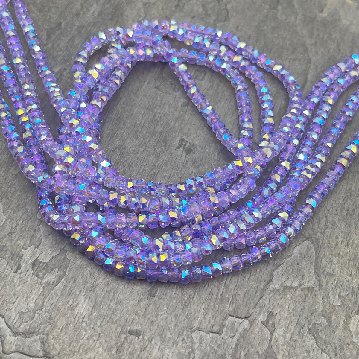 Faceted Glass Beads - 4x2.5mm Heishi Rondelles, Transparent Thistle, Pale Purple with Rainbow AB Finish (Thistle-AB) * 7" Strand