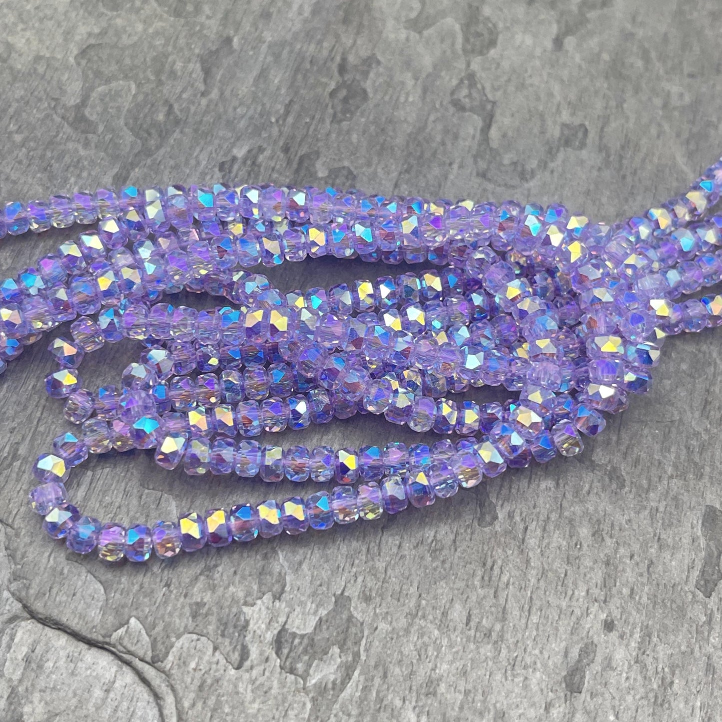 Faceted Glass Beads - 4x2.5mm Heishi Rondelles, Transparent Thistle, Pale Purple with Rainbow AB Finish (Thistle-AB) * 7" Strand