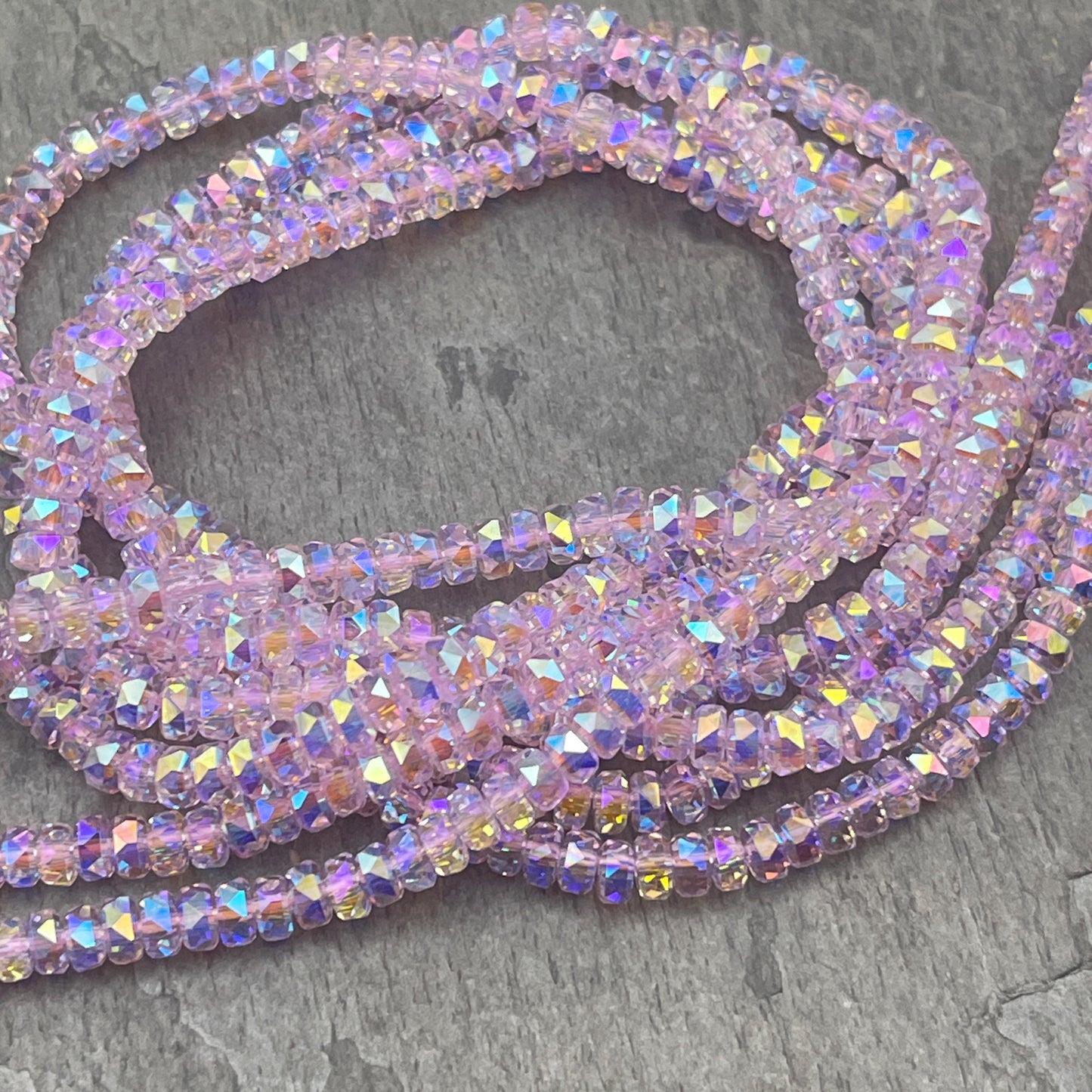 Faceted Glass Beads - 4x2.5mm Heishi Rondelles, Transparent Light Pink with AB Finish (LtPink-AB) * 7" Strand