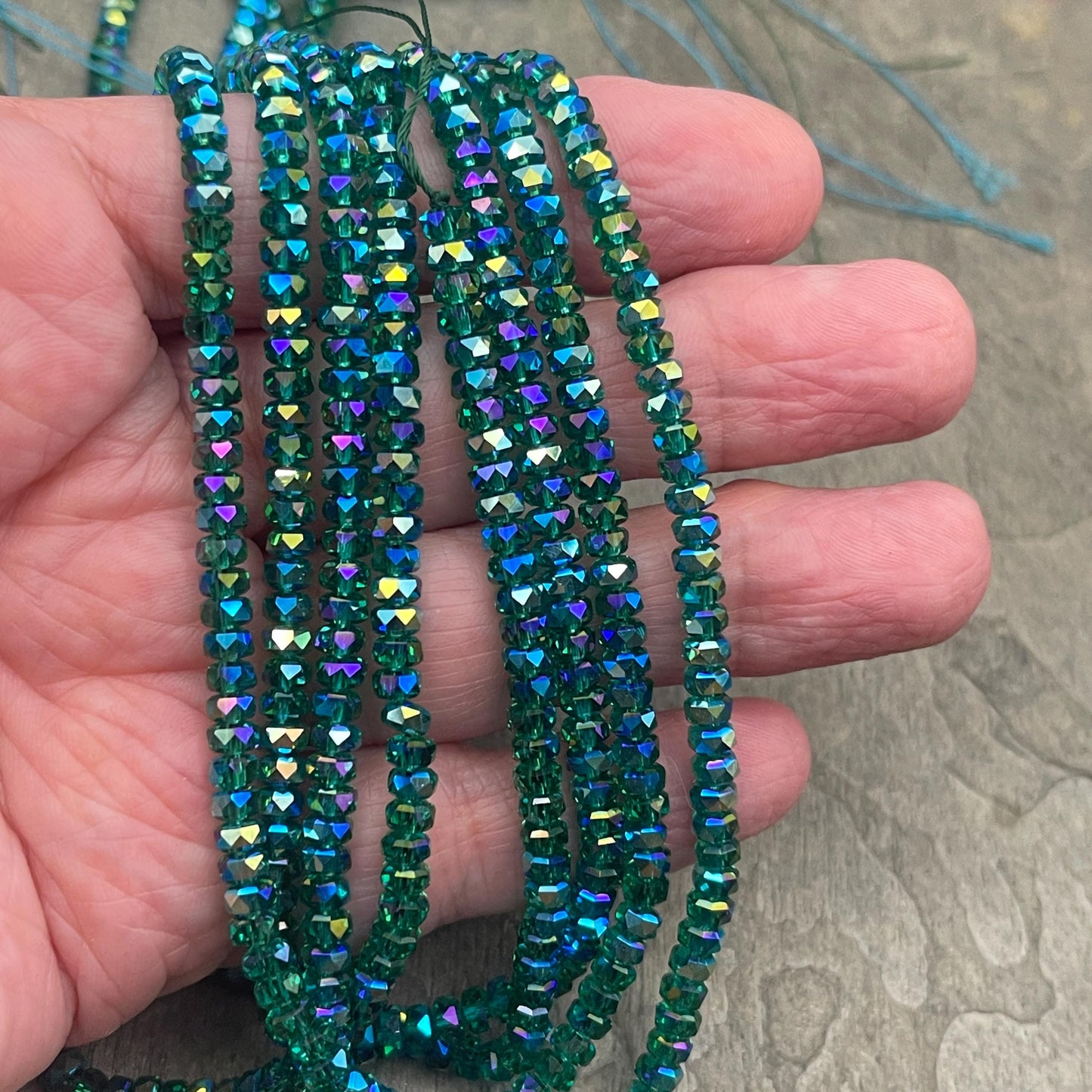 Faceted Glass Beads - 4x2.5mm Heishi Rondelles, Transparent Emerald with Rainbow Iris AB (EmeraldIris) * 7" Strand