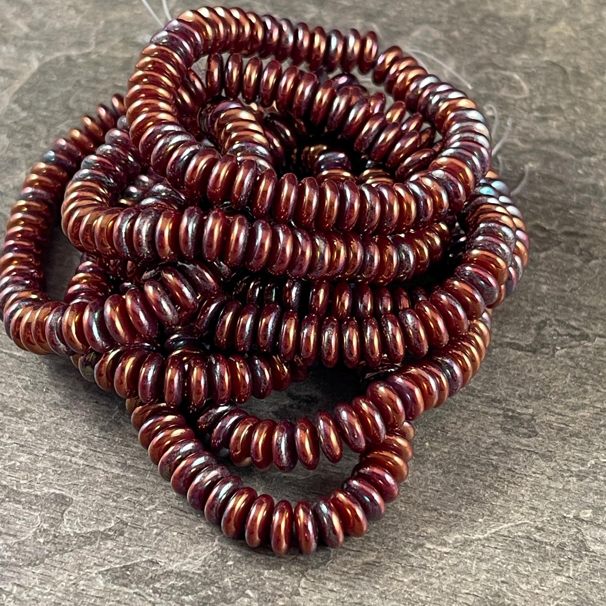 Czech Beads - 6x2mm Heishi Rondelle, Mahogany Red with Purple Blue Luster (DSC/RJ-4757) * Qty. 50