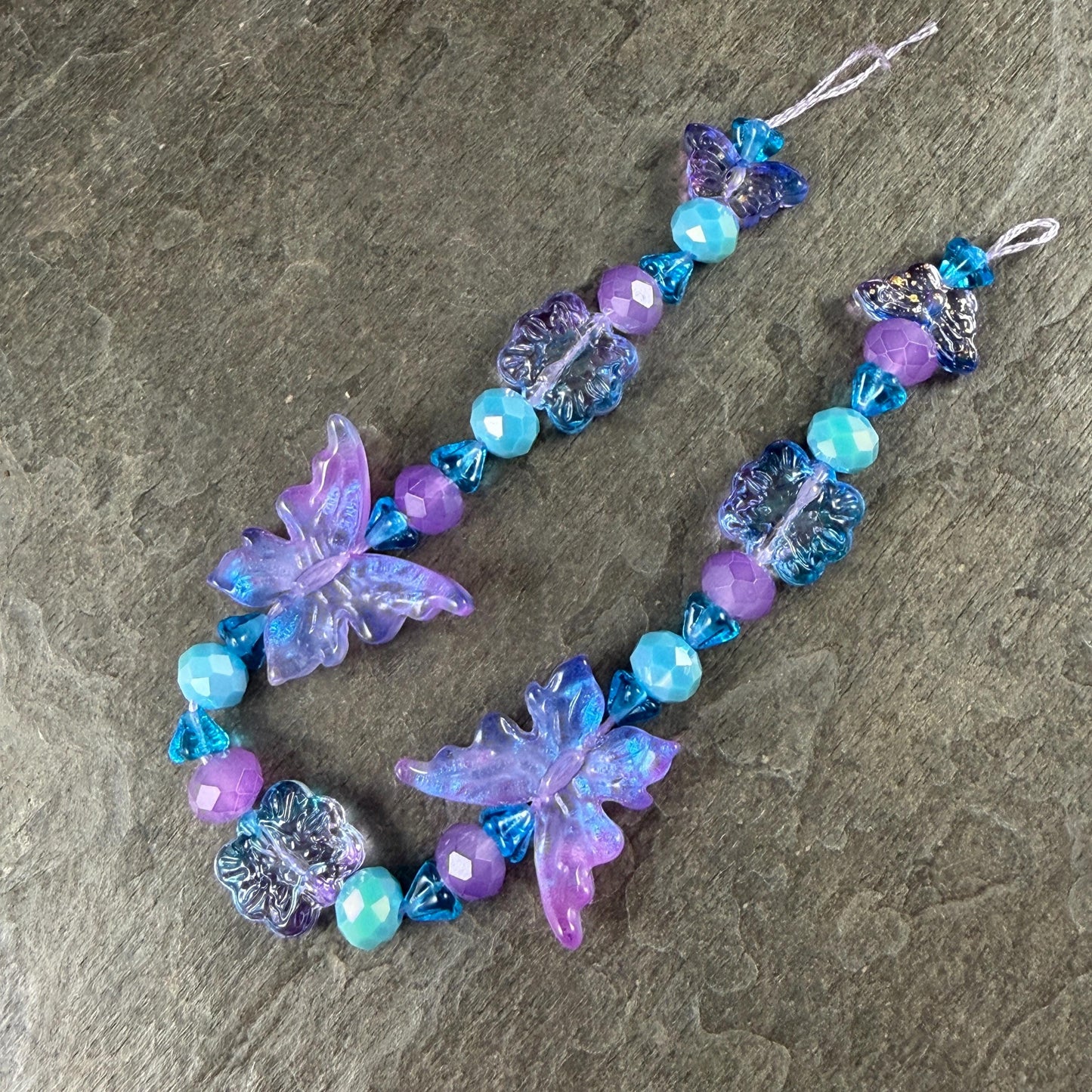Butterfly Beads, Electric Lavender and Aqua, Glass Butterflies and Flowers (DZ-526.23) * 8" Strand 31 Beads