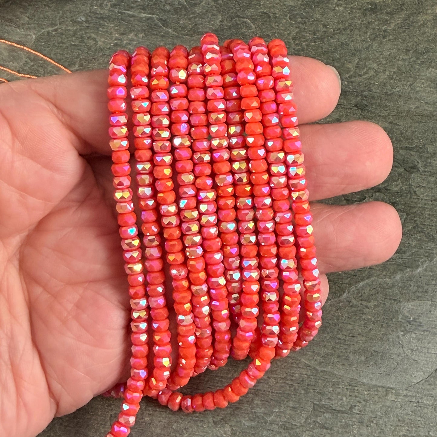 Faceted Glass Beads - 4x2.5mm Heishi Rondelles, Opaque Coral AB (Coral-AB) * 7" Strand