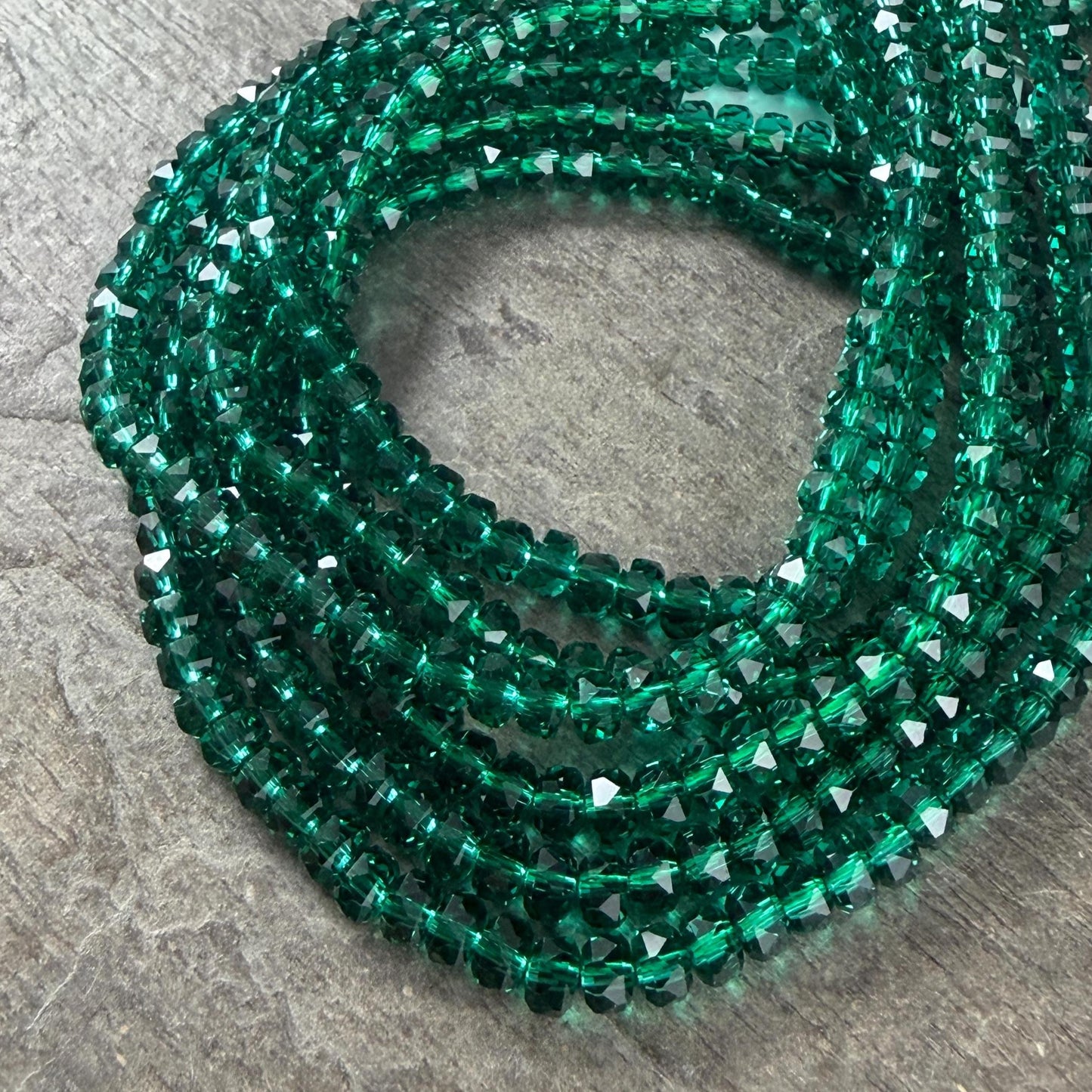 Faceted Glass Beads - 4x2.5mm Heishi Rondelles, Transparent Emerald Green (C539) * 8" Strand