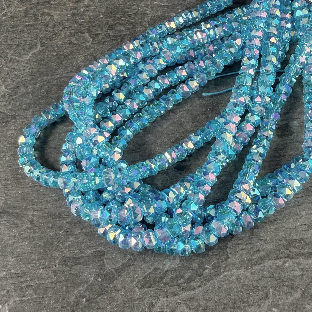 Faceted Glass Beads - 4x2.5mm Heishi Rondelles, Transparent Turquoise with Rainbow AB Finish (C12-AB) * 8" Strand