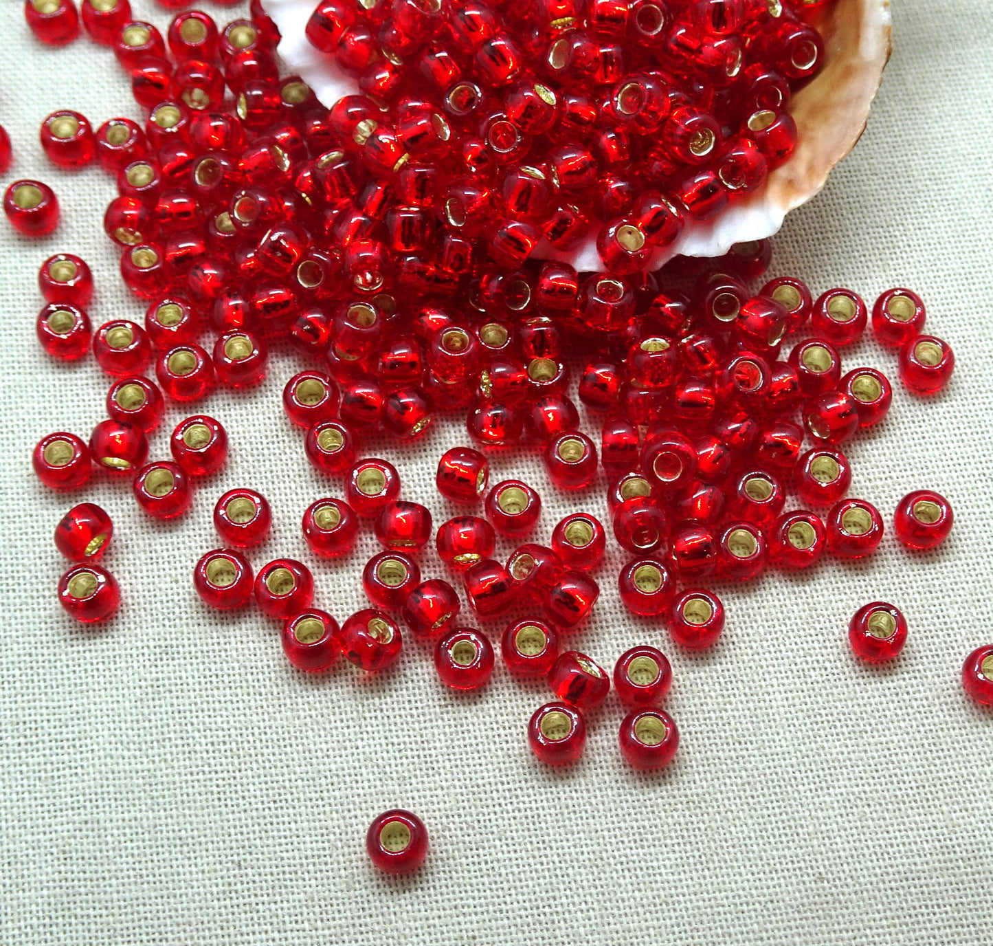 4mm Transparent Ruby Red Seed Beads, TOHO 6/0 Round Red Glass with Silver Core (T6/SM-25C) * Qty. 15 Grams