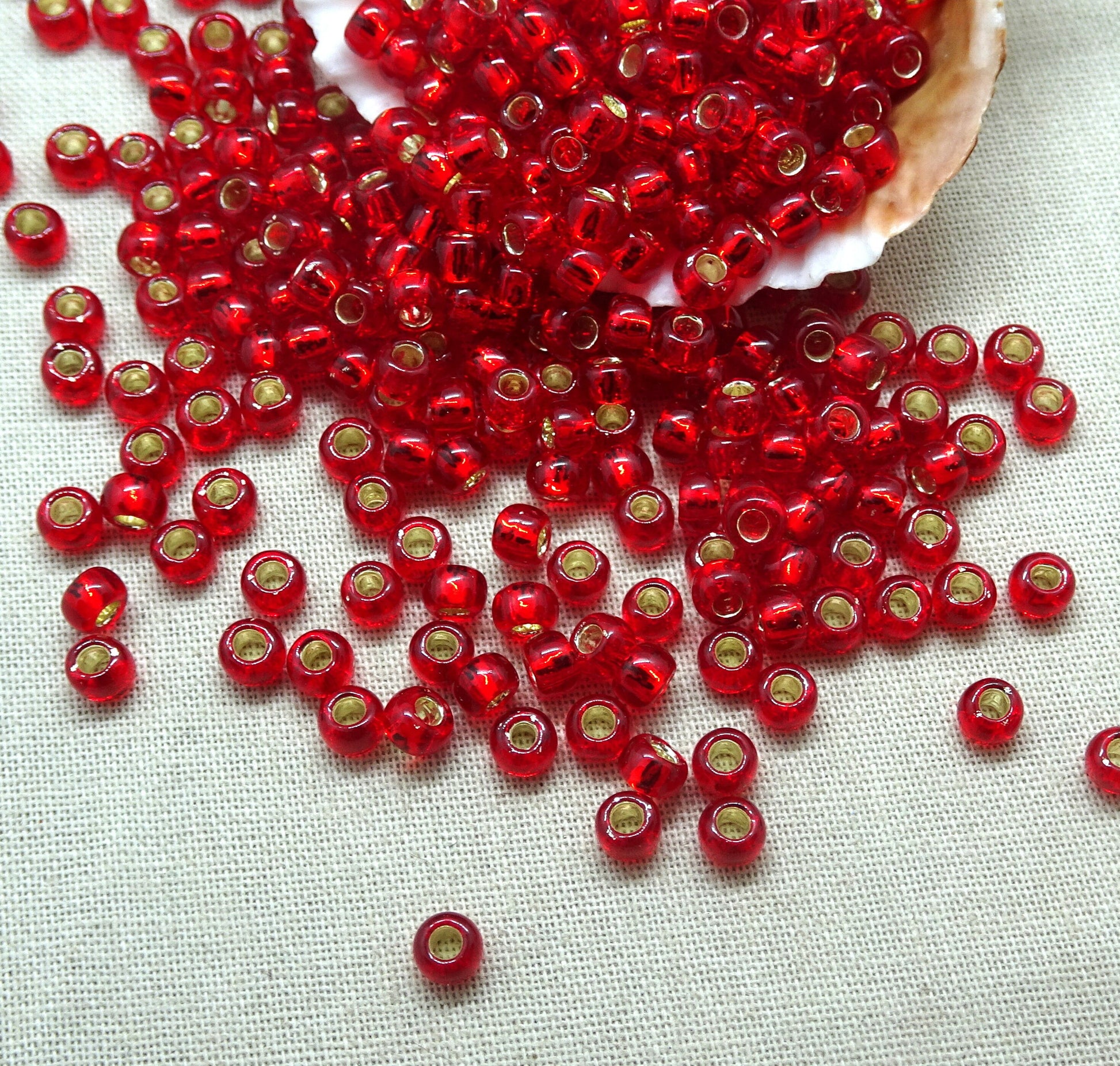4mm Transparent Ruby Red Seed Beads, TOHO 6/0 Round Red Glass with Silver Core (T6/SM-25C) * Qty. 15 Grams