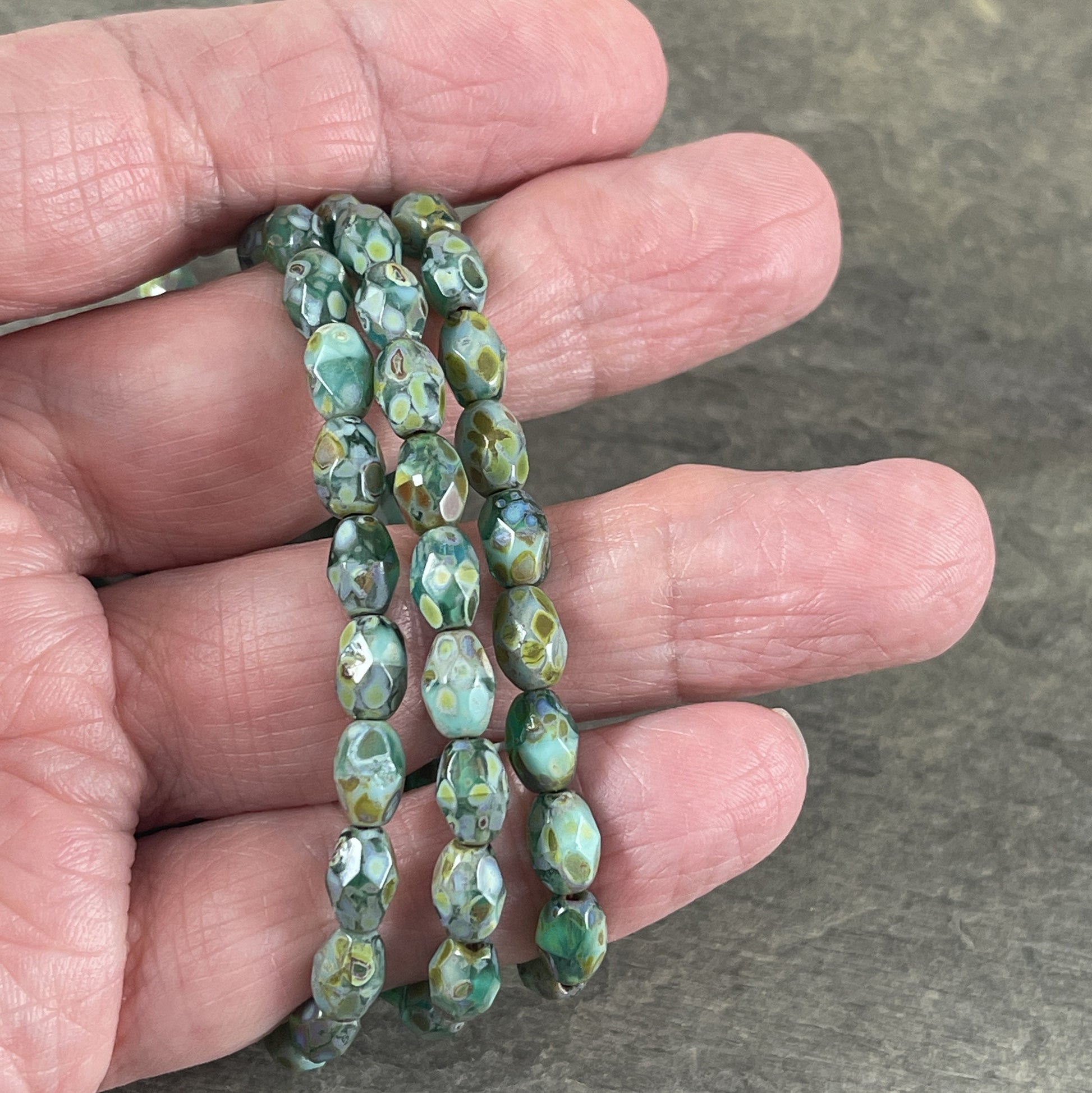 Czech Glass - 7x5mm Faceted Oval, Turquoise, Capri Blue and Emerald Green with Picasso Finish (FOV/N-0601) * Qty. 20