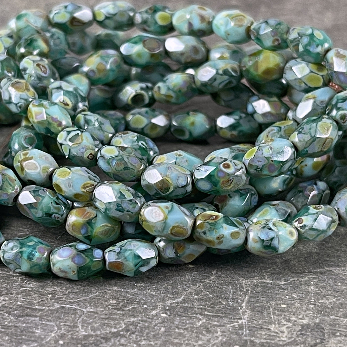 Czech Glass - 7x5mm Faceted Oval, Turquoise, Capri Blue and Emerald Green with Picasso Finish (FOV/N-0601) * Qty. 20