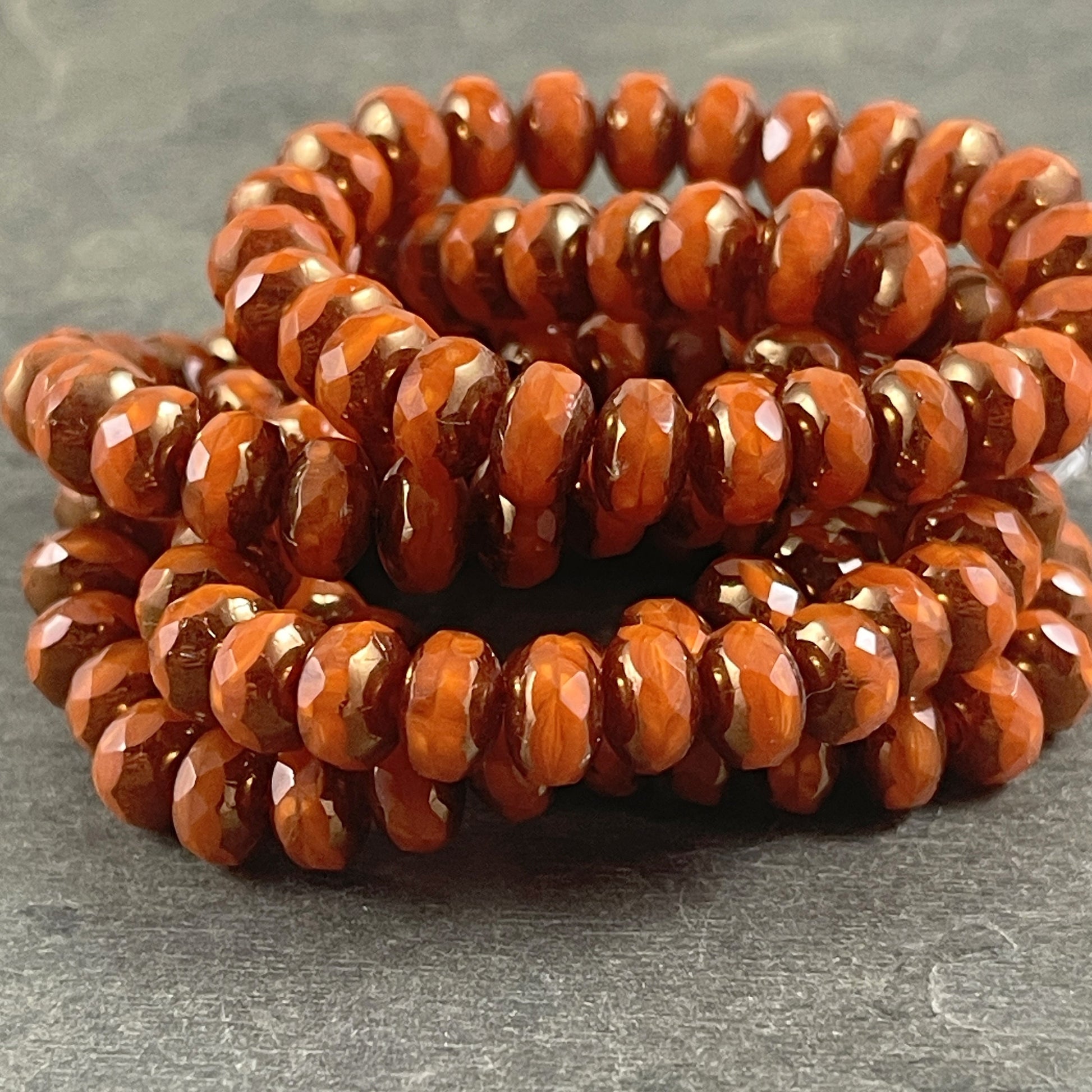 Czech Glass Beads - 5x7mm Opaque Orange Faceted Rondelle, Orange Opaline Glass with Bronze Picasso (R7/RJ-2758) * Qty. 25