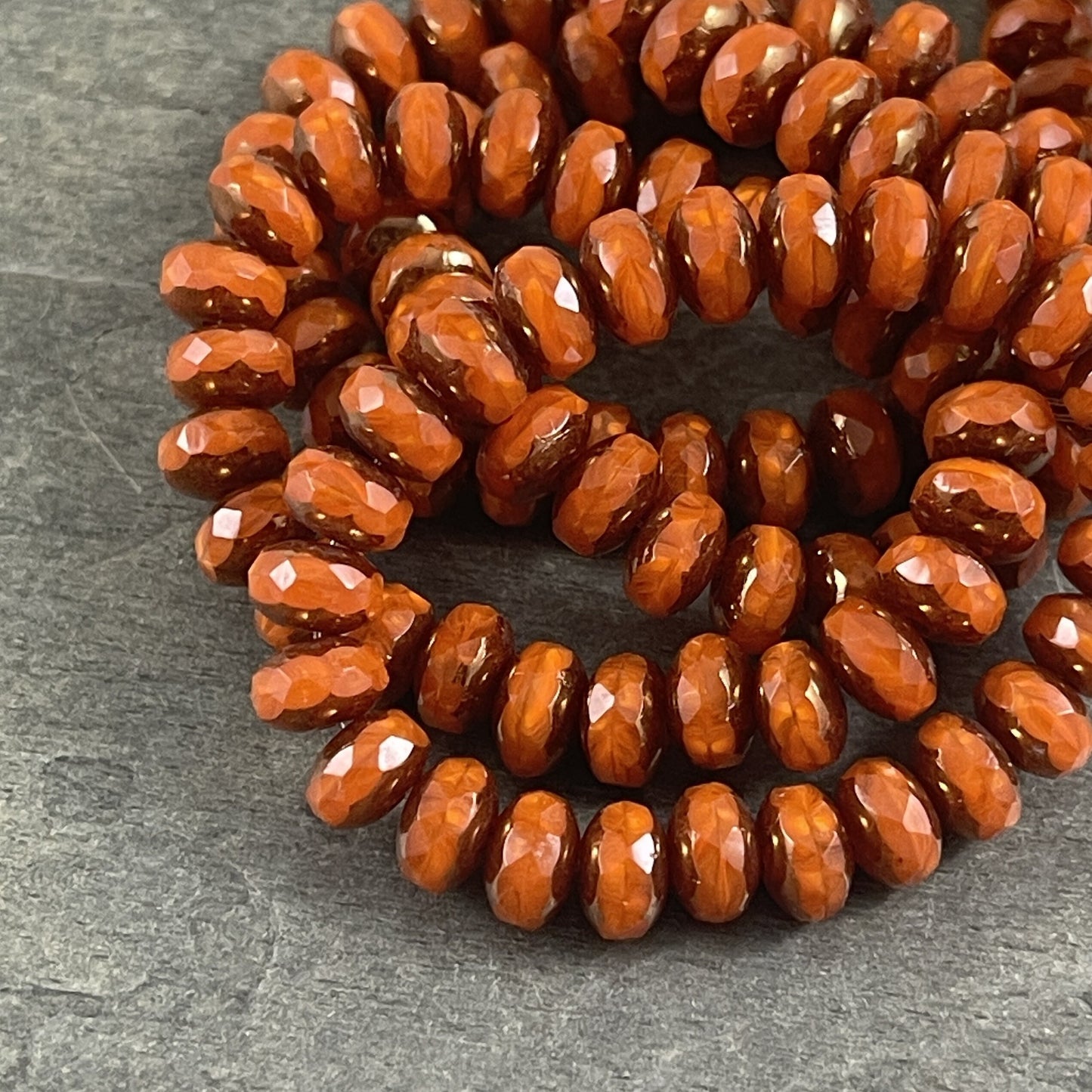 Czech Glass Beads - 5x7mm Opaque Orange Faceted Rondelle, Orange Opaline Glass with Bronze Picasso (R7/RJ-2758) * Qty. 25