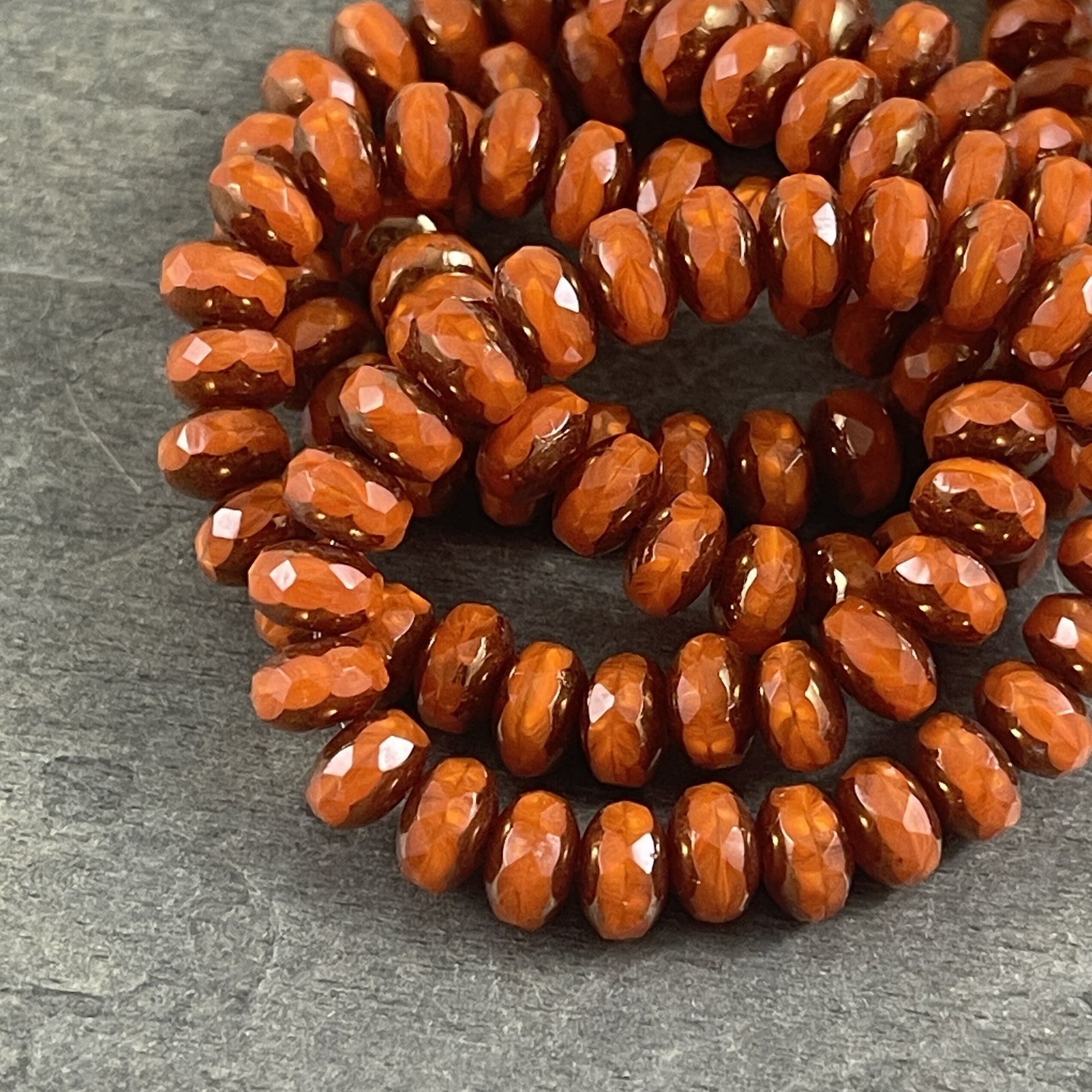 Czech Glass Beads - 5x7mm Opaque Orange Faceted Rondelle, Orange Opaline Glass with Bronze Picasso (R7/RJ-2758) * Qty. 25