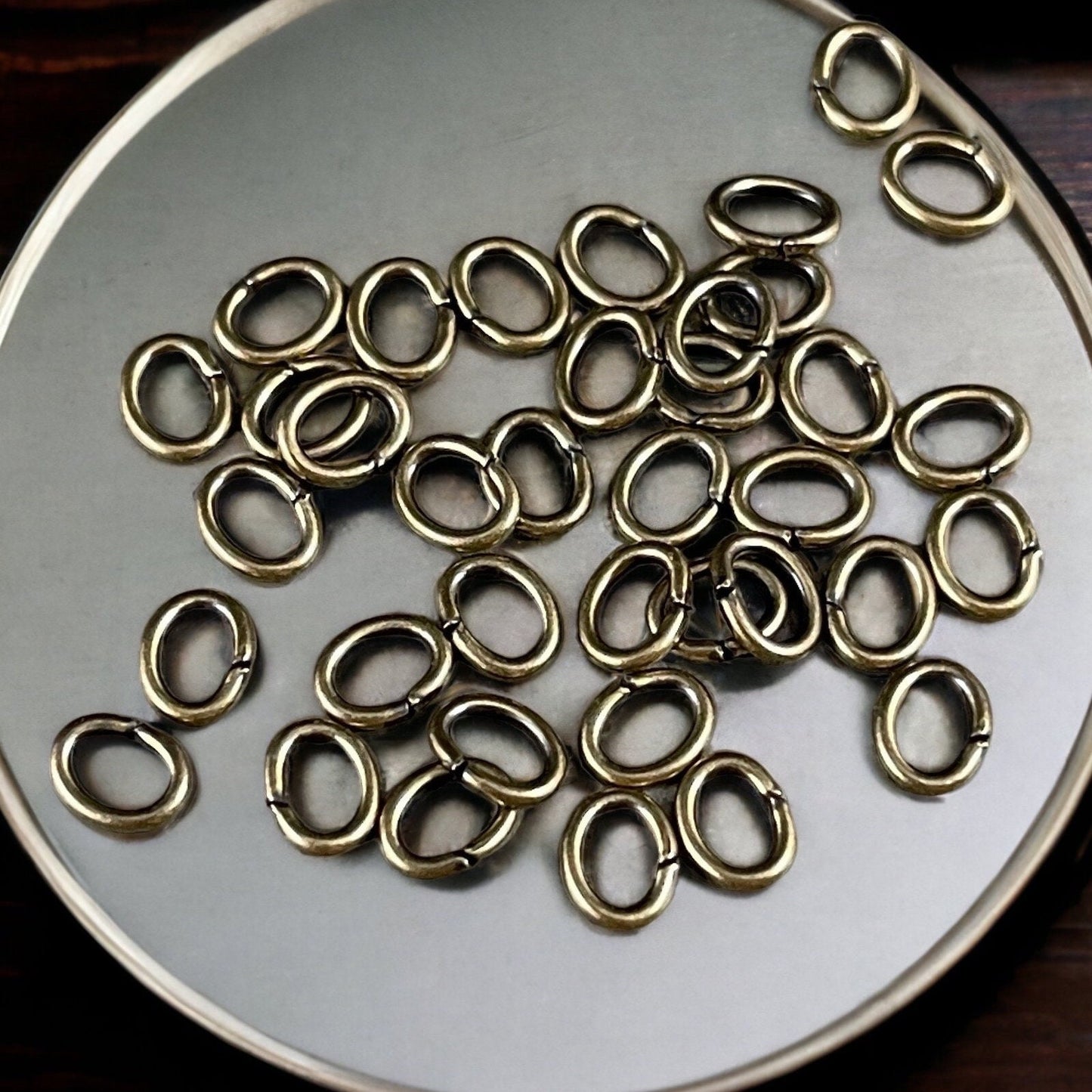 6x4mm Oval Jump Rings, 18g Open, Antiqued Brass Plated (FMG/5054) * Qty. 100