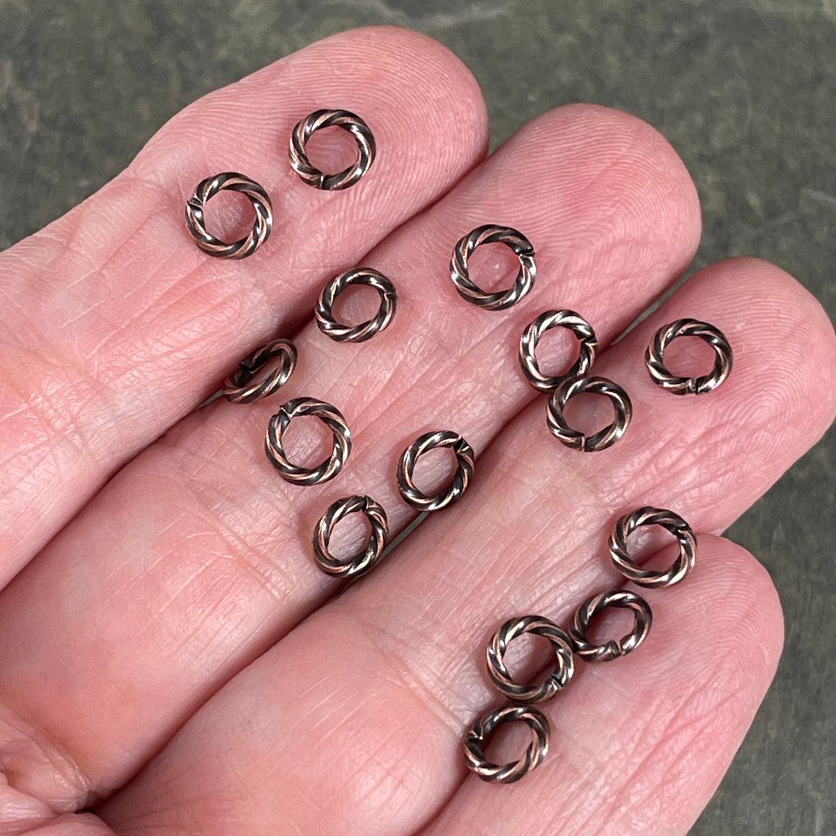 6mm Twisted Jumprings, 16g Open, Antiqued Copper Plated Brass (FMG/5044) * Qty. 100