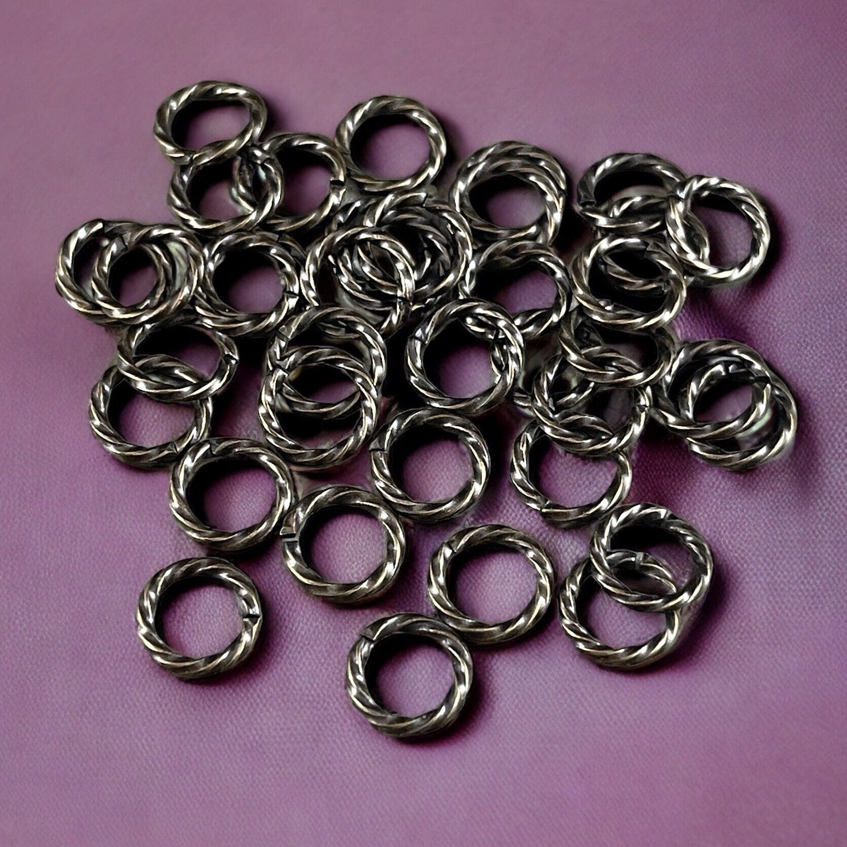 8mm Twisted Jumprings, 16g Open, Antiqued Brass (FMG/5032) * Qty. 100