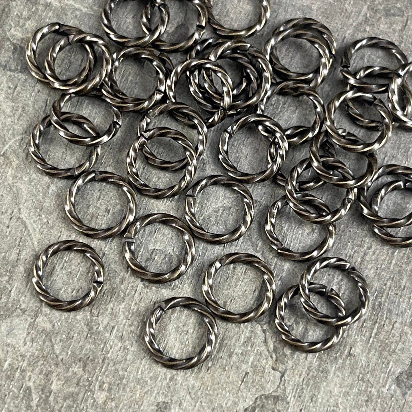 8mm Twisted Jumprings, 16g Open, Antiqued Brass (FMG/5032) * Qty. 100