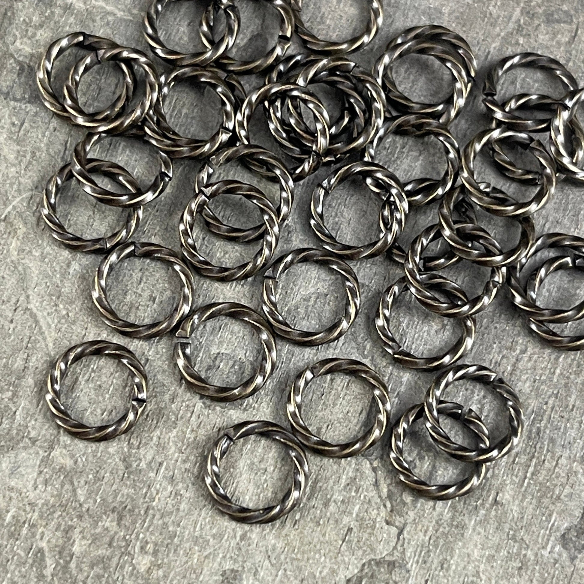 8mm Twisted Jumprings, 16g Open, Antiqued Brass (FMG/5032) * Qty. 100