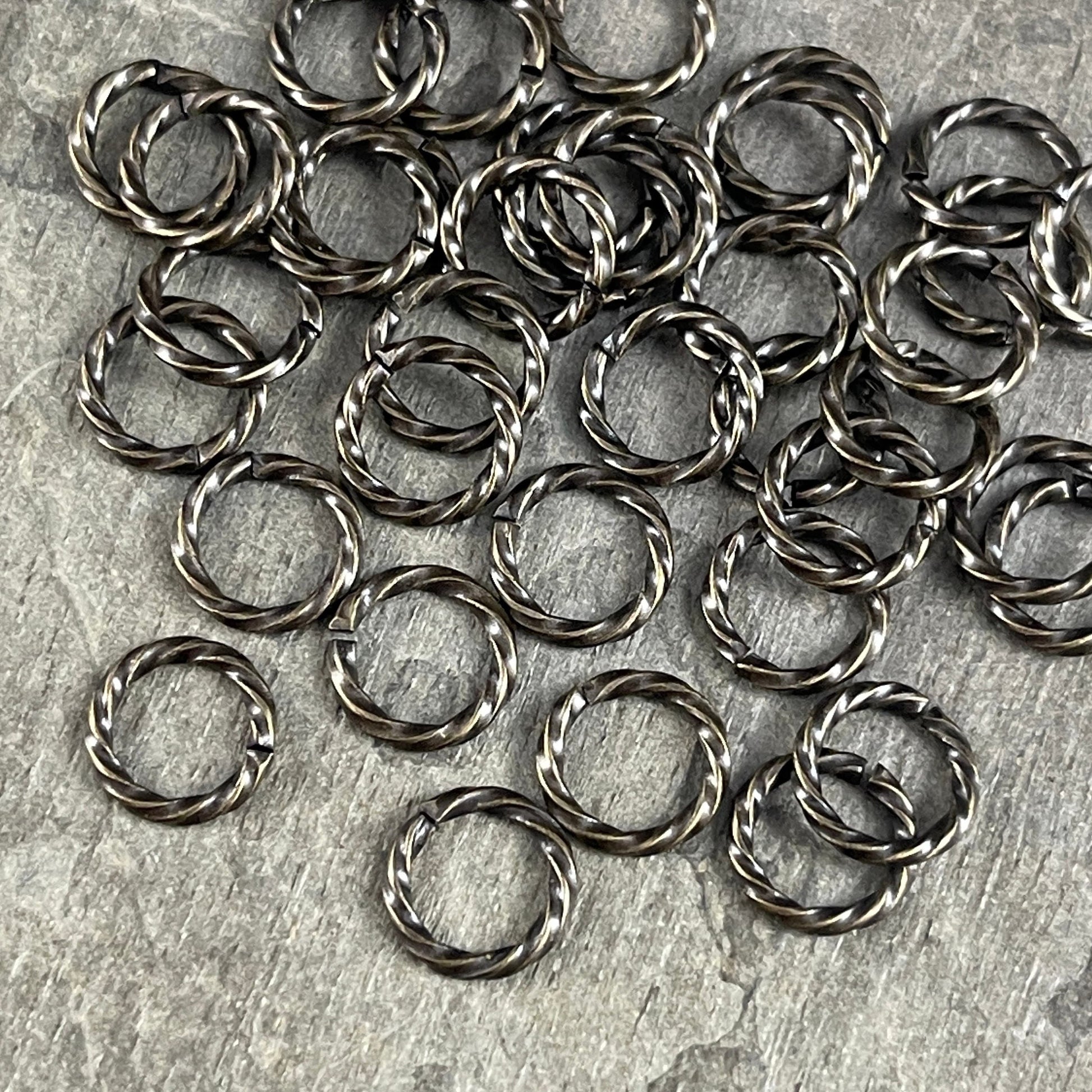 8mm Twisted Jumprings, 16g Open, Antiqued Brass (FMG/5032) * Qty. 100