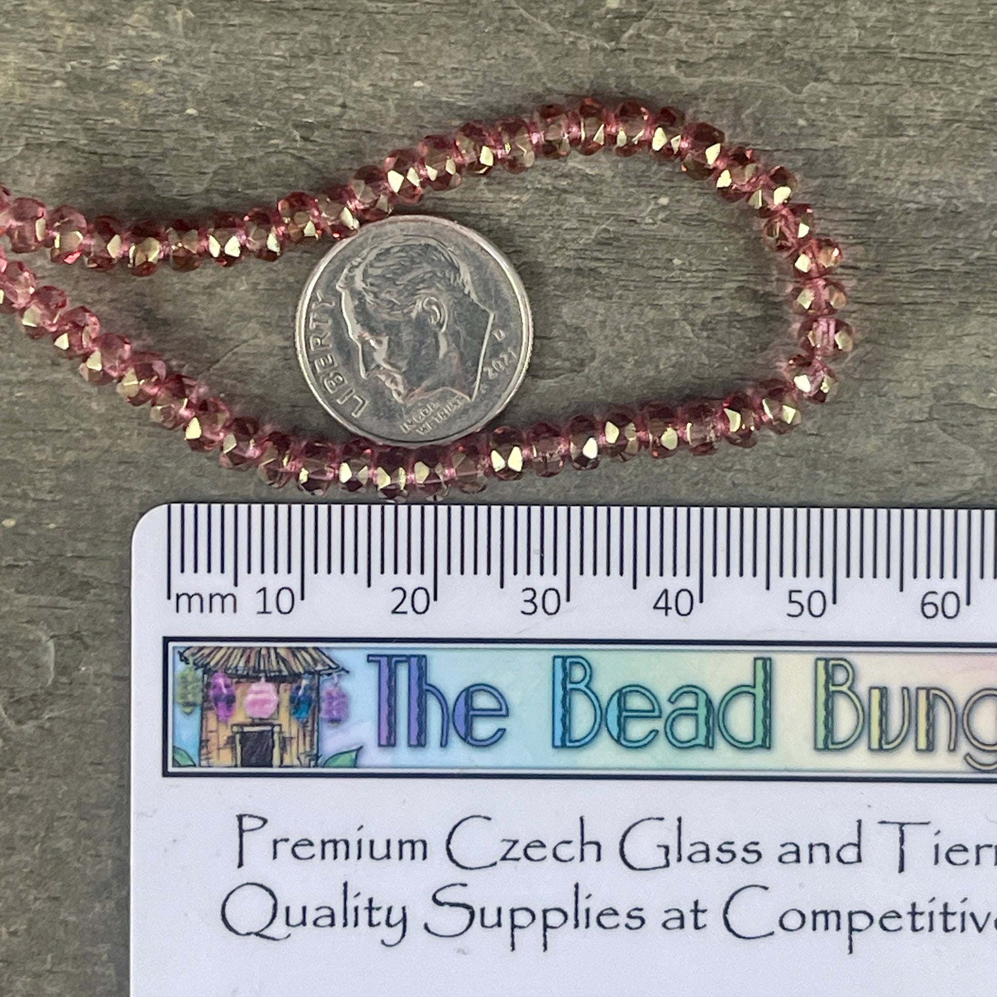 Czech Beads - 4x2.5mm Faceted Rondelles, Transparent Fuchsia with Golden Luster (RON3/N-1283) * 50 Beads