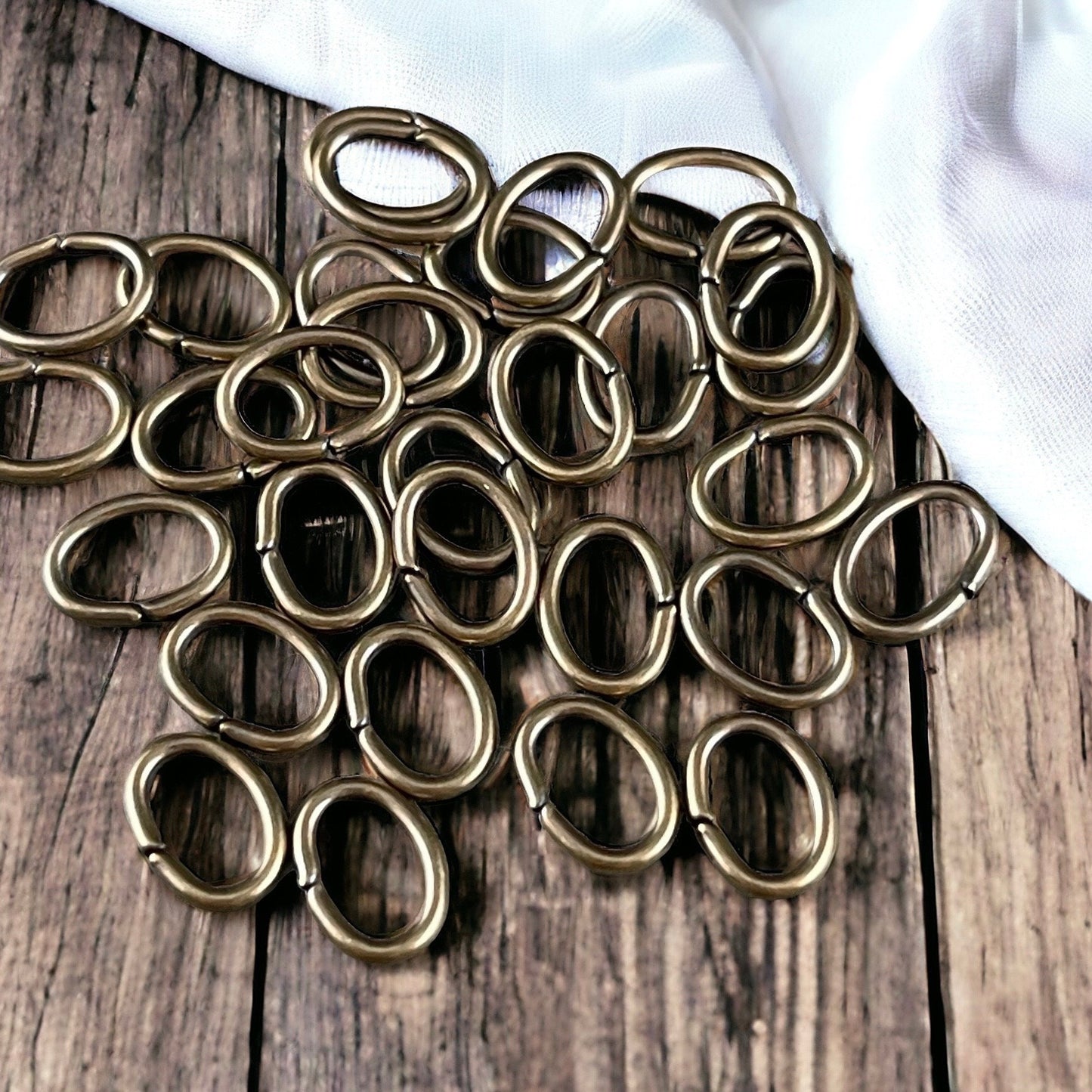 8x6mm Brass Oval Jump Rings ~ 18g Oval Jump Rings ~ Brass Bronze Jump Rings ~ Antiqued Brass Open Jump Rings (FMG/5063) * Qty. 100