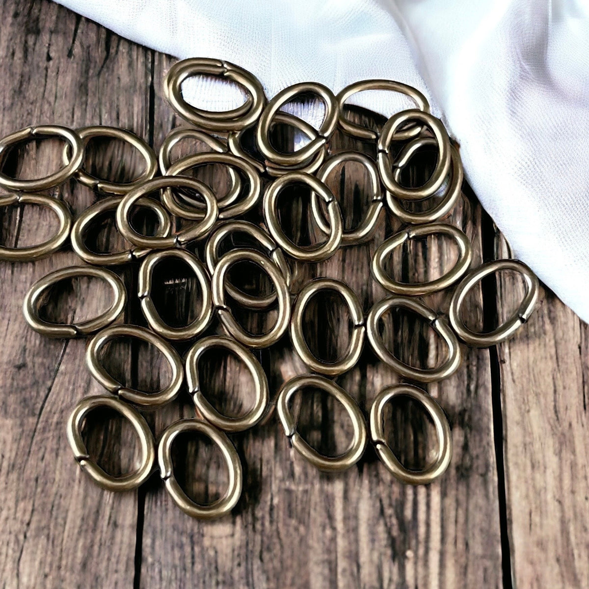 8x6mm Oval Jump Rings, 18g Open, Antiqued Brass Plated (FMG/5063) * Qty. 100
