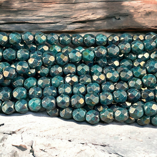 Czech Beads - 6mm Faceted Round, Dark Turquoise with Bronze Picasso (FP6/SM-BT6315) * Qty. 25