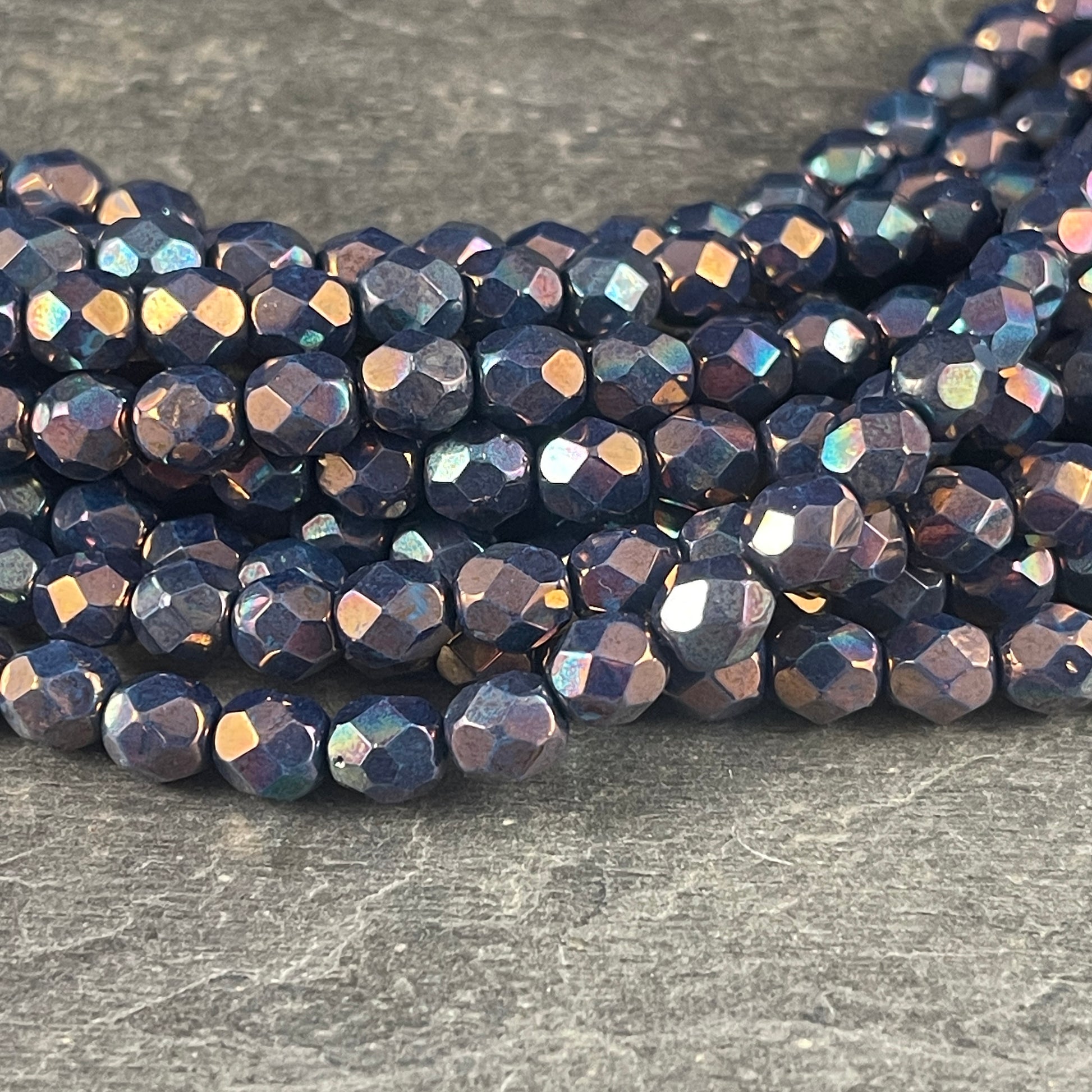 6mm Bluish Purple Iridescent Beads, Czech Glass Fire Polished Faceted Round Beads - Oxidized Bronze Titanium Luster (FP6/SM-15865) * Qty. 25