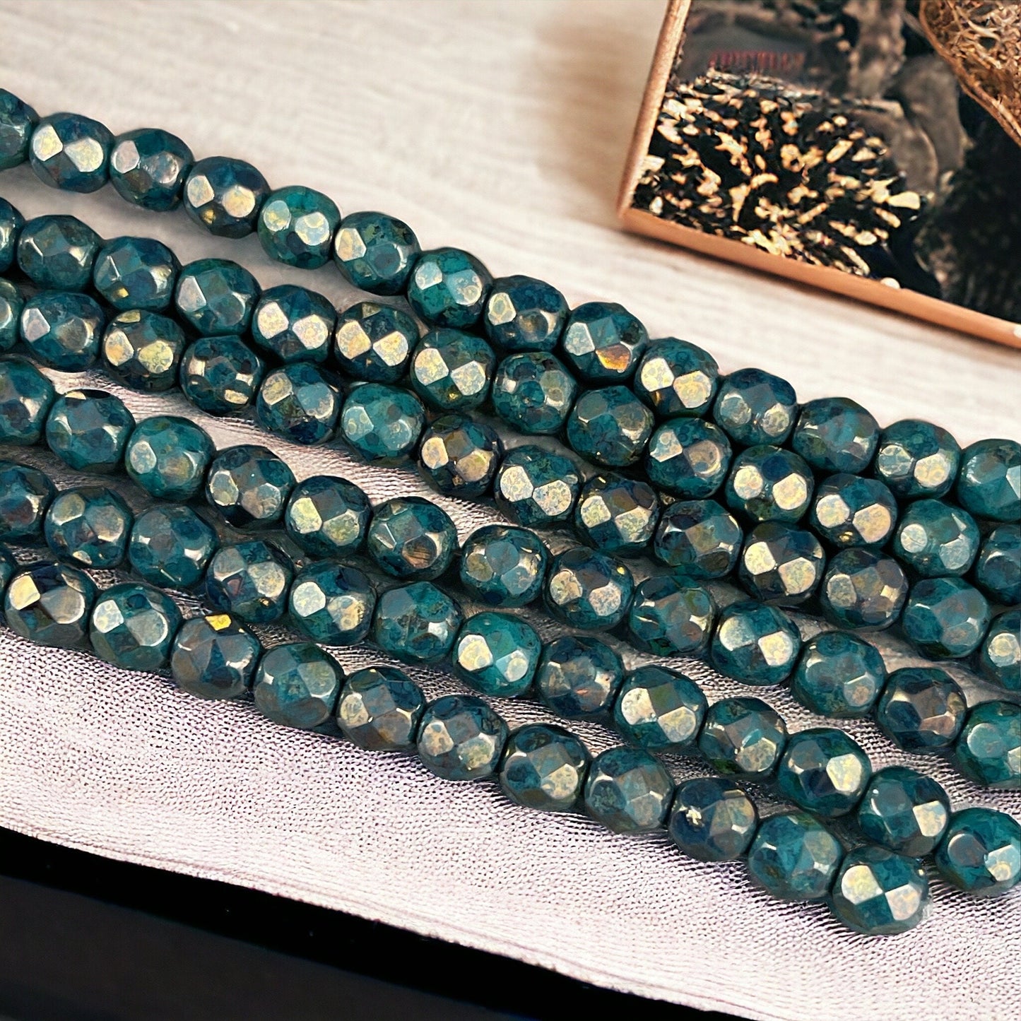 Czech Beads - 6mm Faceted Round, Dark Turquoise with Bronze Picasso (FP6/SM-BT6315) * Qty. 25