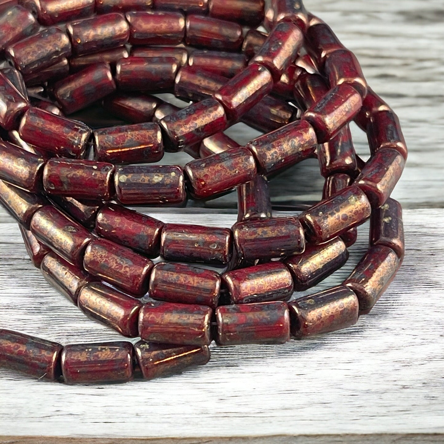 Czech Glass Beads - 9x5mm Tube Bead, Opaque Maroon with Bronze Picasso (TBE/N-0671) * Qty. 16