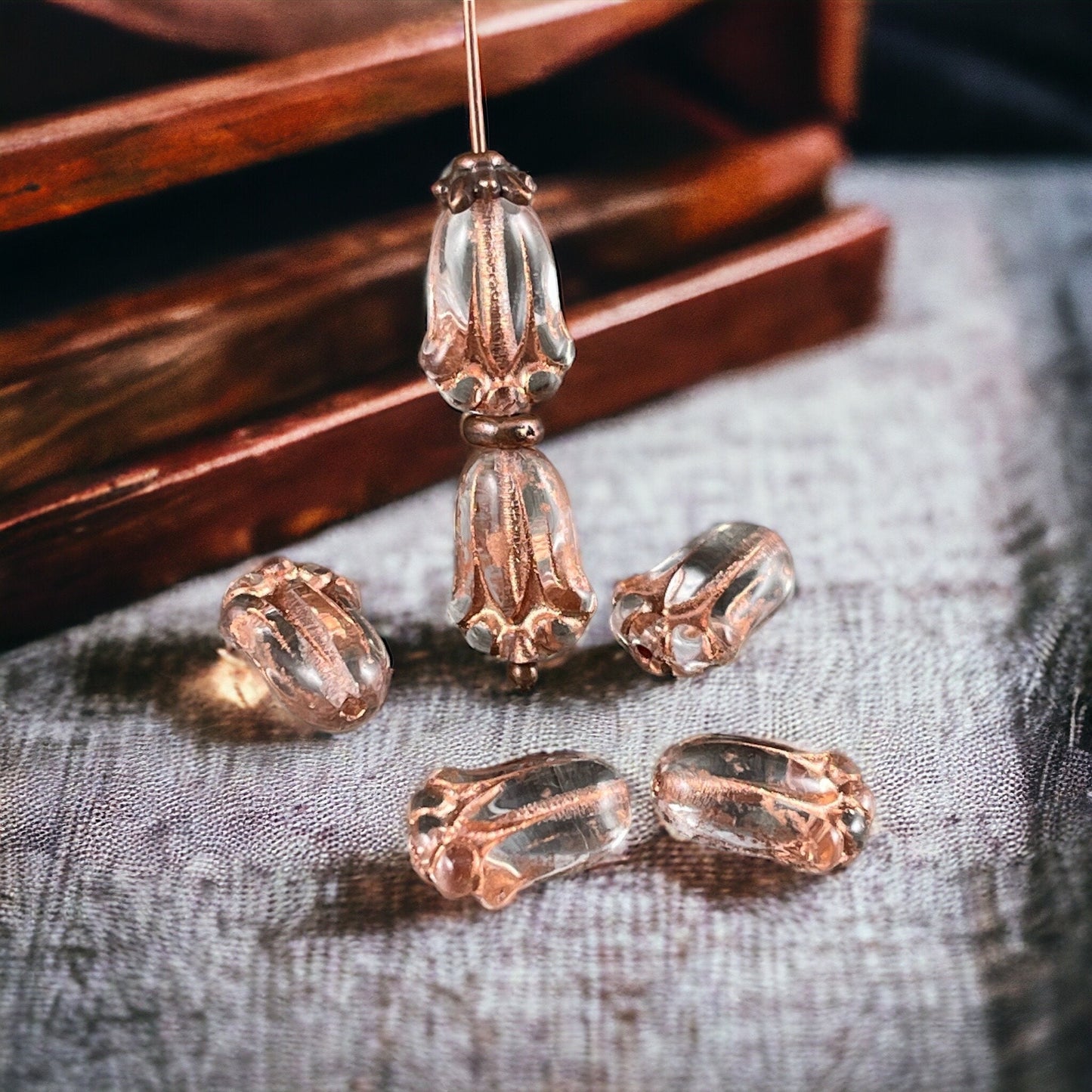 Czech Glass Flower Beads, 12x8mm Lily Bud, Clear Glass with Copper Wash (LBud31) * Qty. 12