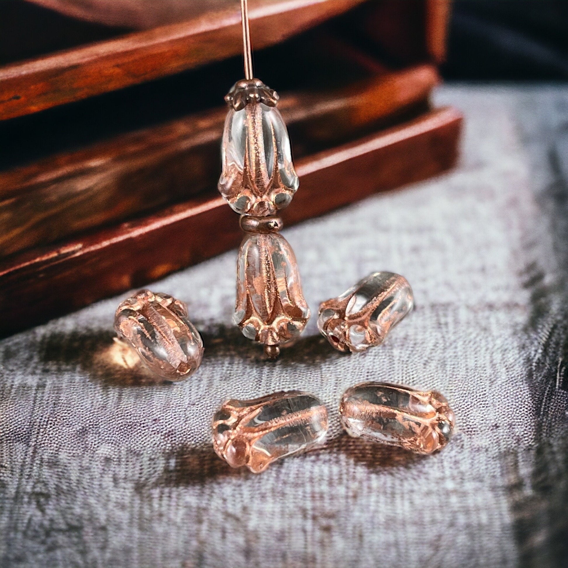 Czech Glass Flower Beads, 12x8mm Lily Bud, Clear Glass with Copper Wash (LBud31) * Qty. 12