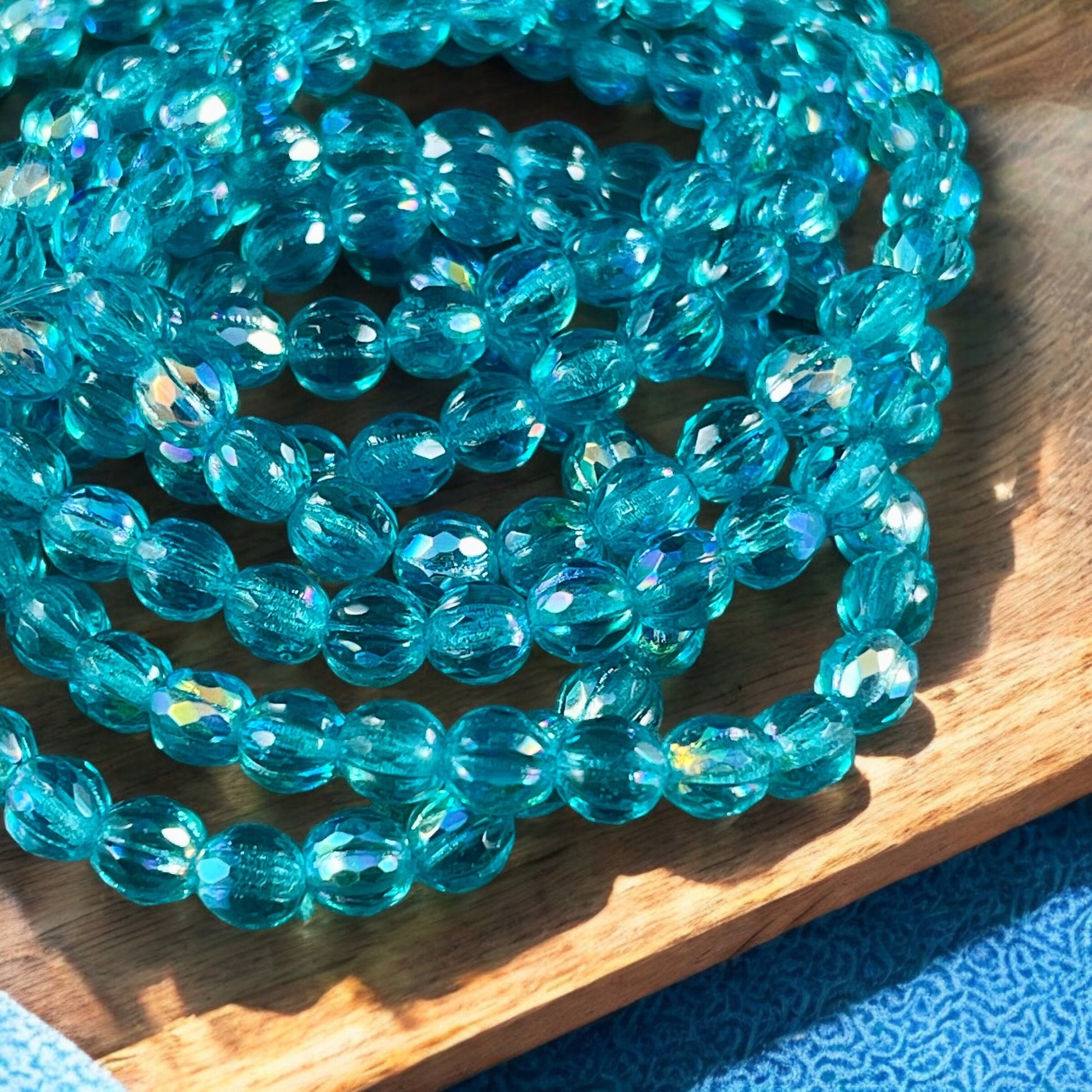 6mm Sky Blue Czech Glass Faceted Melon Shape Beads, Transparent Blue Glass with AB Finish (FM6/N-1973) * Qty. 25