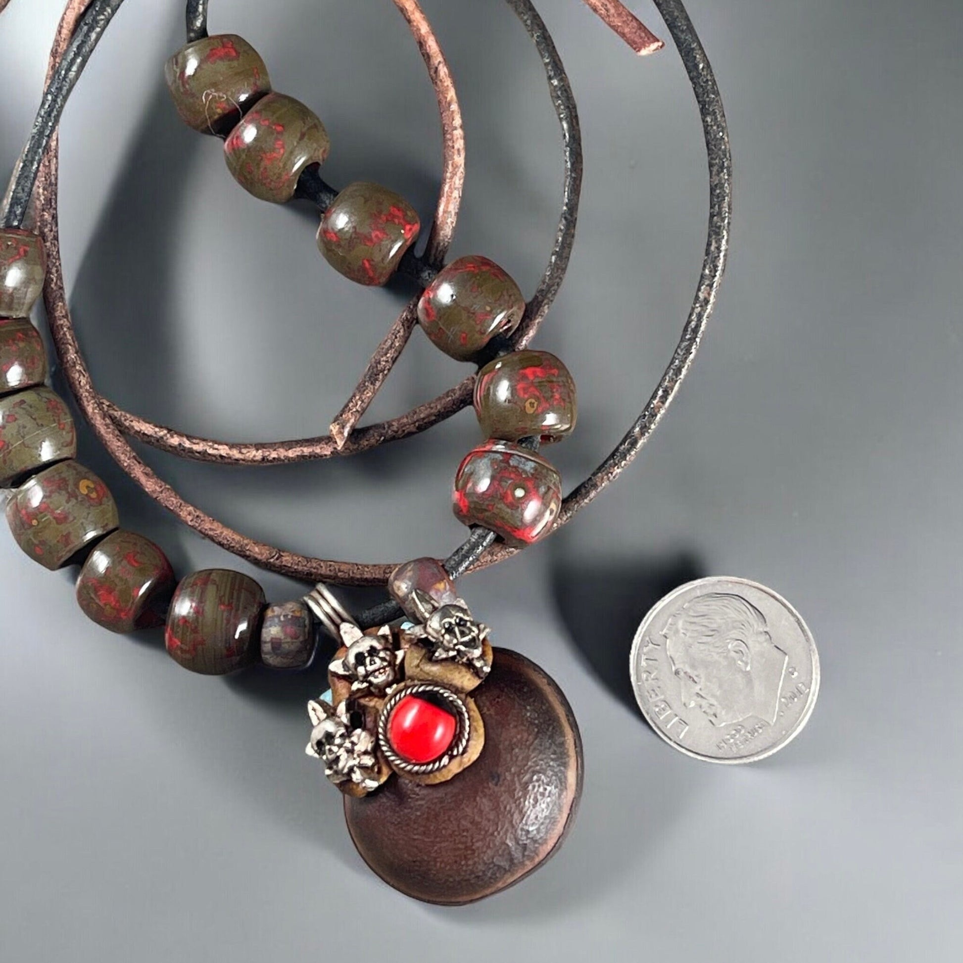 Leather Pendant with Skulls, Unique Pendant with Metal Skulls and Bead Accents, Includes Leather cord and Aged Picasso Beads