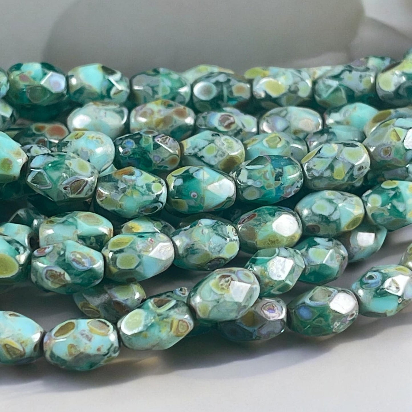 Czech Glass - 7x5mm Faceted Oval, Turquoise, Capri Blue and Emerald Green with Picasso Finish (FOV/N-0601) * Qty. 20
