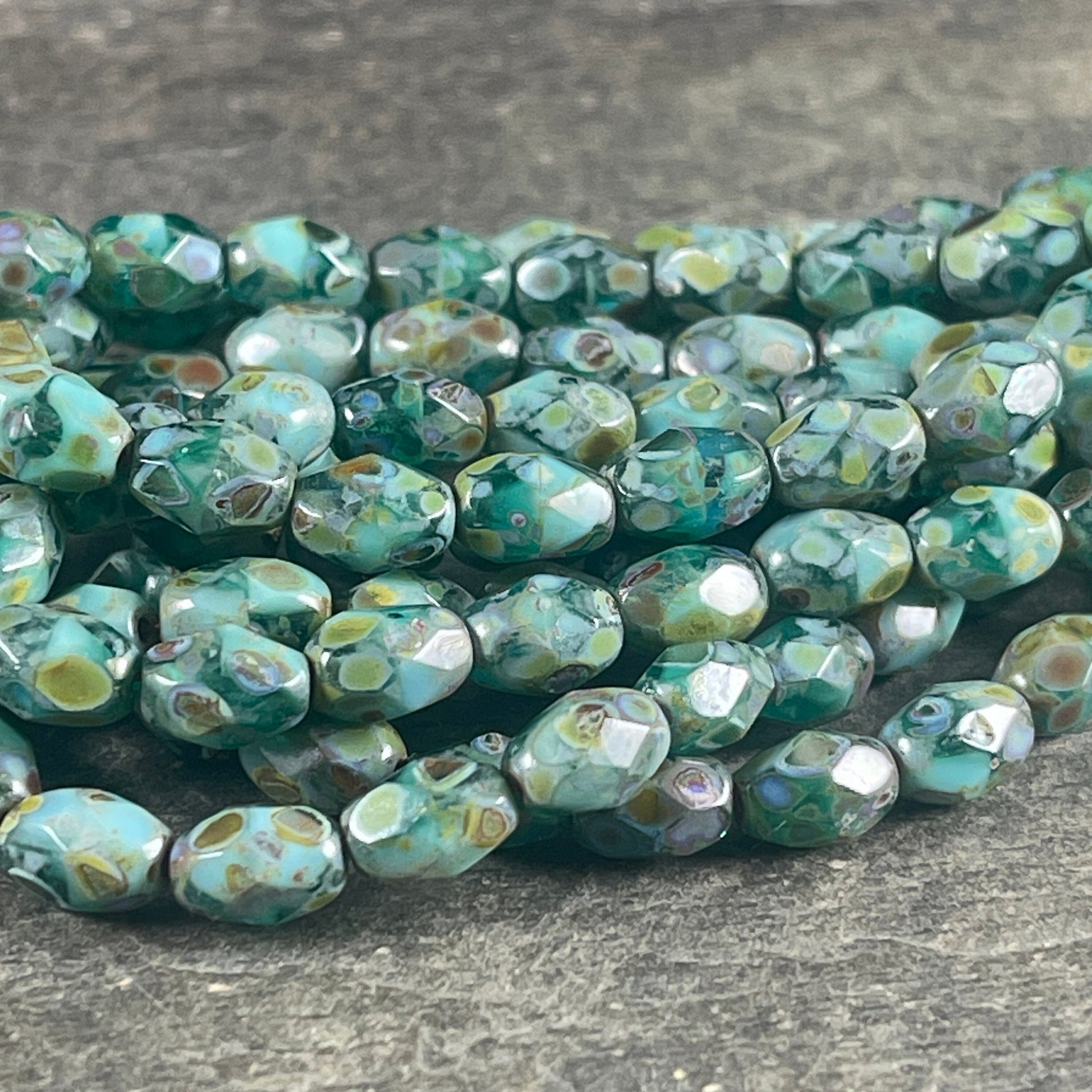 Czech Glass - 7x5mm Faceted Oval, Turquoise, Capri Blue and Emerald Green with Picasso Finish (FOV/N-0601) * Qty. 20