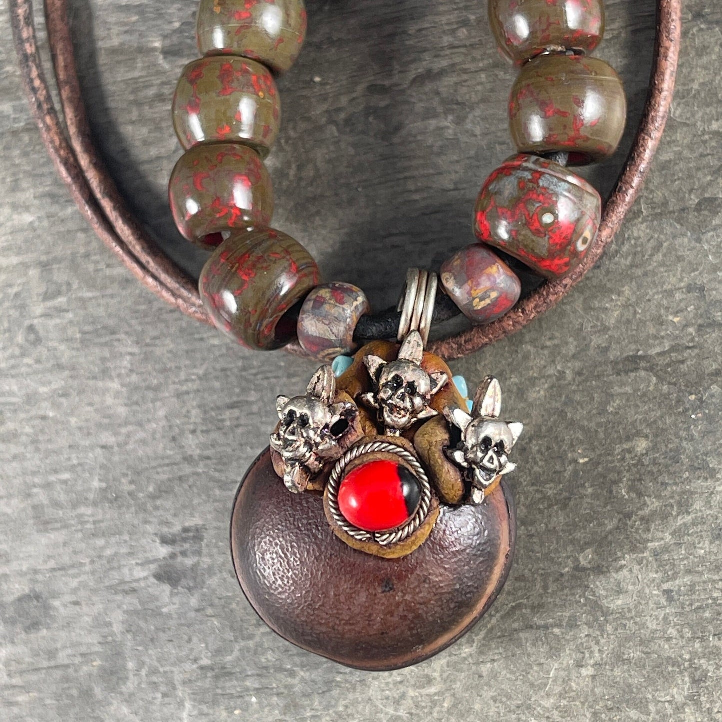 Leather Pendant with Skulls, Unique Pendant with Metal Skulls and Bead Accents, Includes Leather cord and Aged Picasso Beads