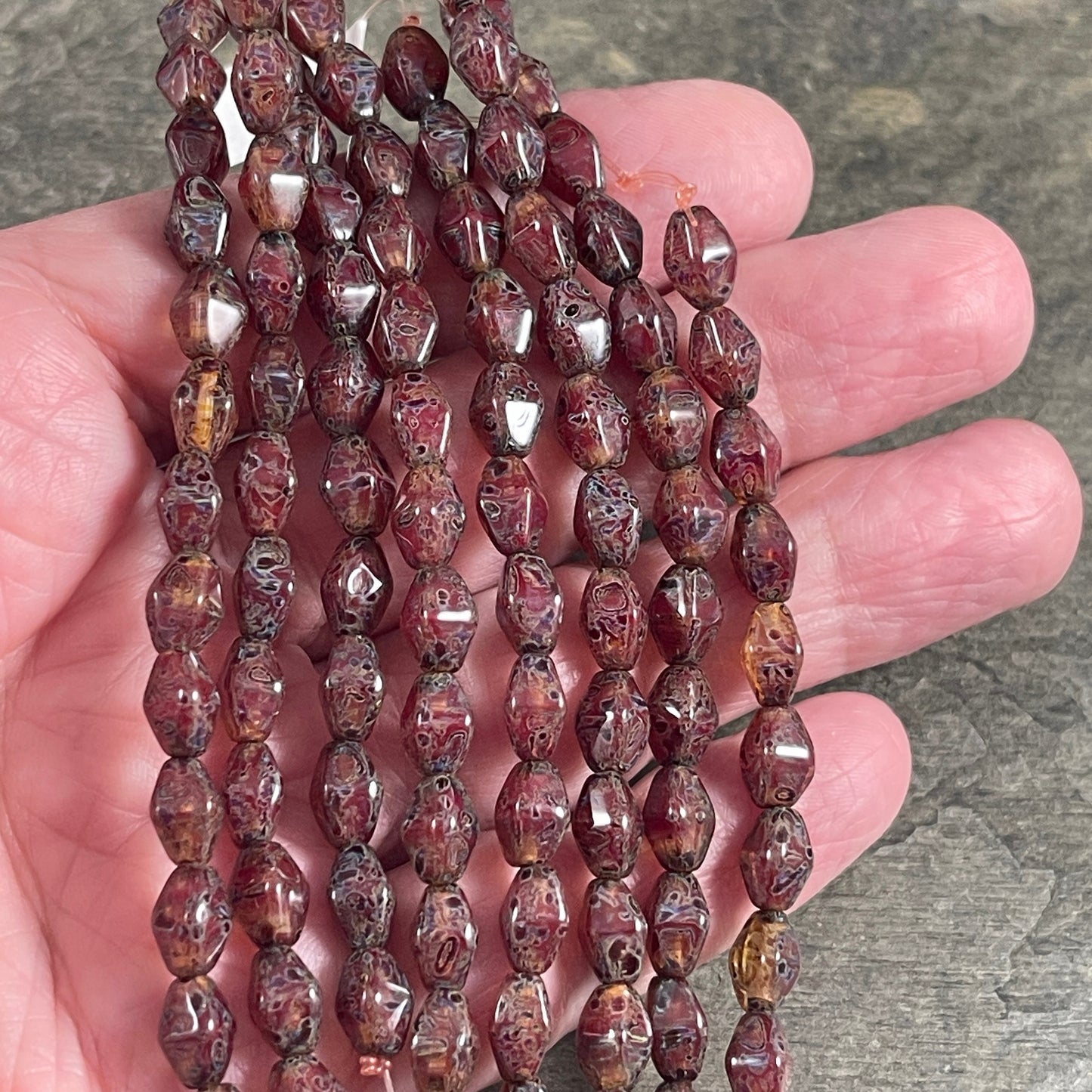 Czech Glass Beads - Transparent Crystal Red with Travertine Picasso , 8x6mm Dark Red, Rustic Picasso, Elongated Bicone (EB5) * Qty. 16